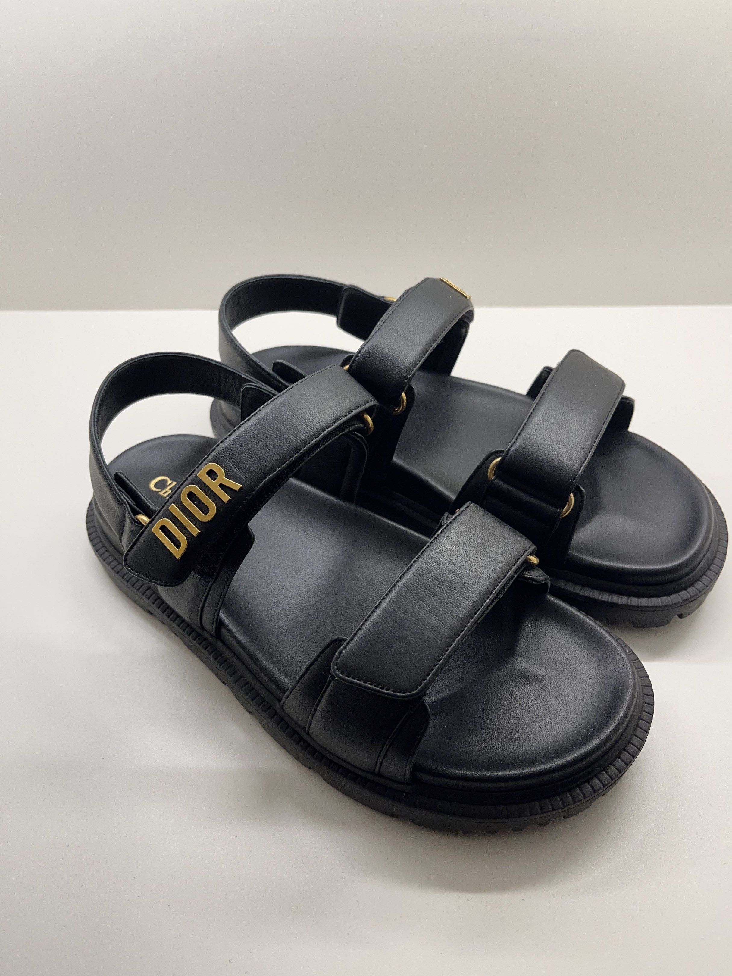 Authentic Dioract Black Sandals Lambskin - 38US (Category: Sneakers & Footwear) located in Bacolod City. Submitted by silvermannequin (Listing ID 1418775490, Image 1). Description: - Black Dior sandals - Adjustable straps - Gold Dior logo detail - Thick sole - Sleek and modern design - Suitable for various occasions 38US COMES COMPLETE WITH RECEIPT.