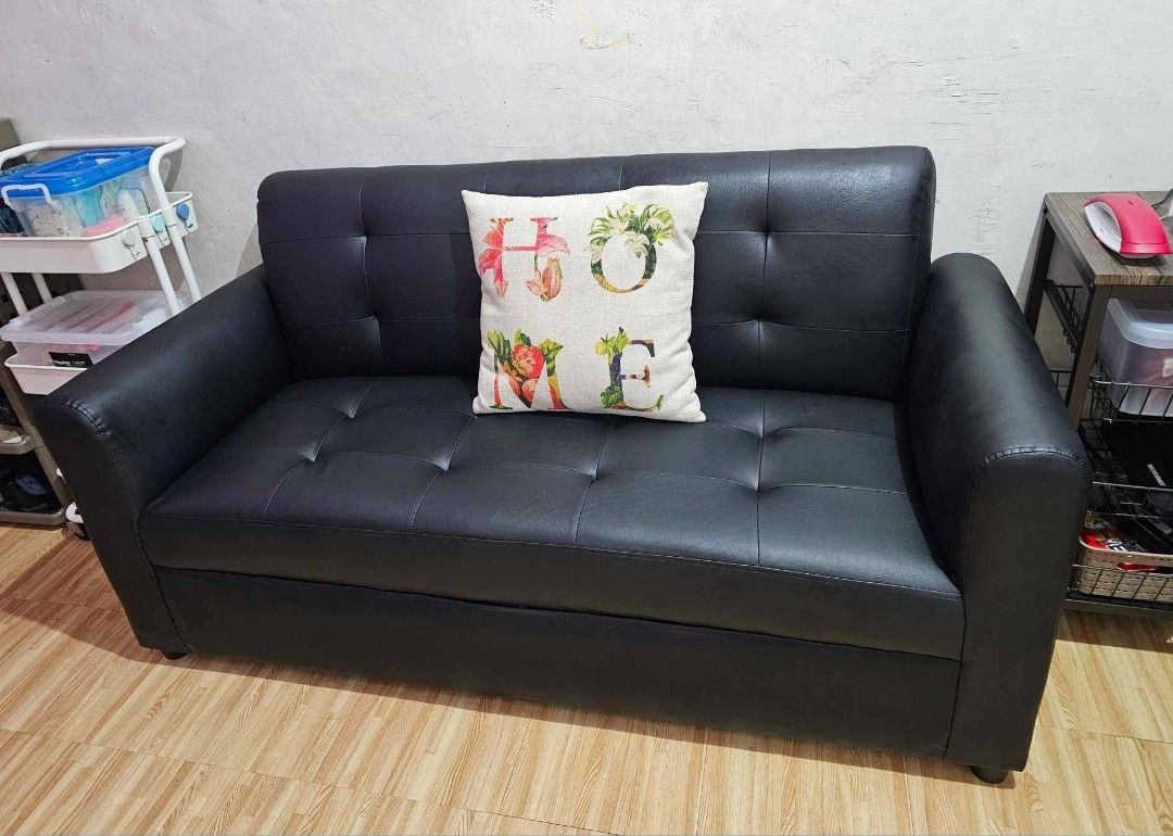 Black 3 Seater Sofa (Category: Sofas) located in Manila. Submitted by kcnog (Listing ID 1418701042, Image 1). Description: - Black 3-seater sofa - Button-tufted design - Features armrests - Sturdy base - Upholstered in dark material - Includes decorative pillow.
