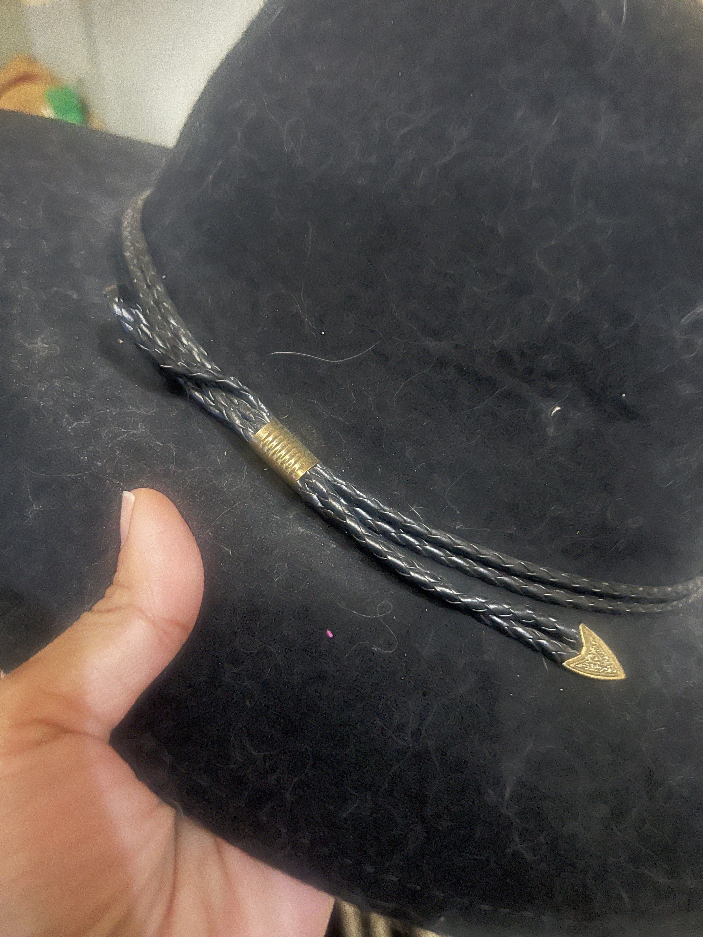 Black Cowboy Hat with Braided Band (Category: Caps & Hats) located in Manila. Submitted by cheek888 (Listing ID 1418776393, Image 3). Description: - Black cowboy hat - Braided band with metal accent - Wide brim - Structured crown - Felt-like material - Classic style.
