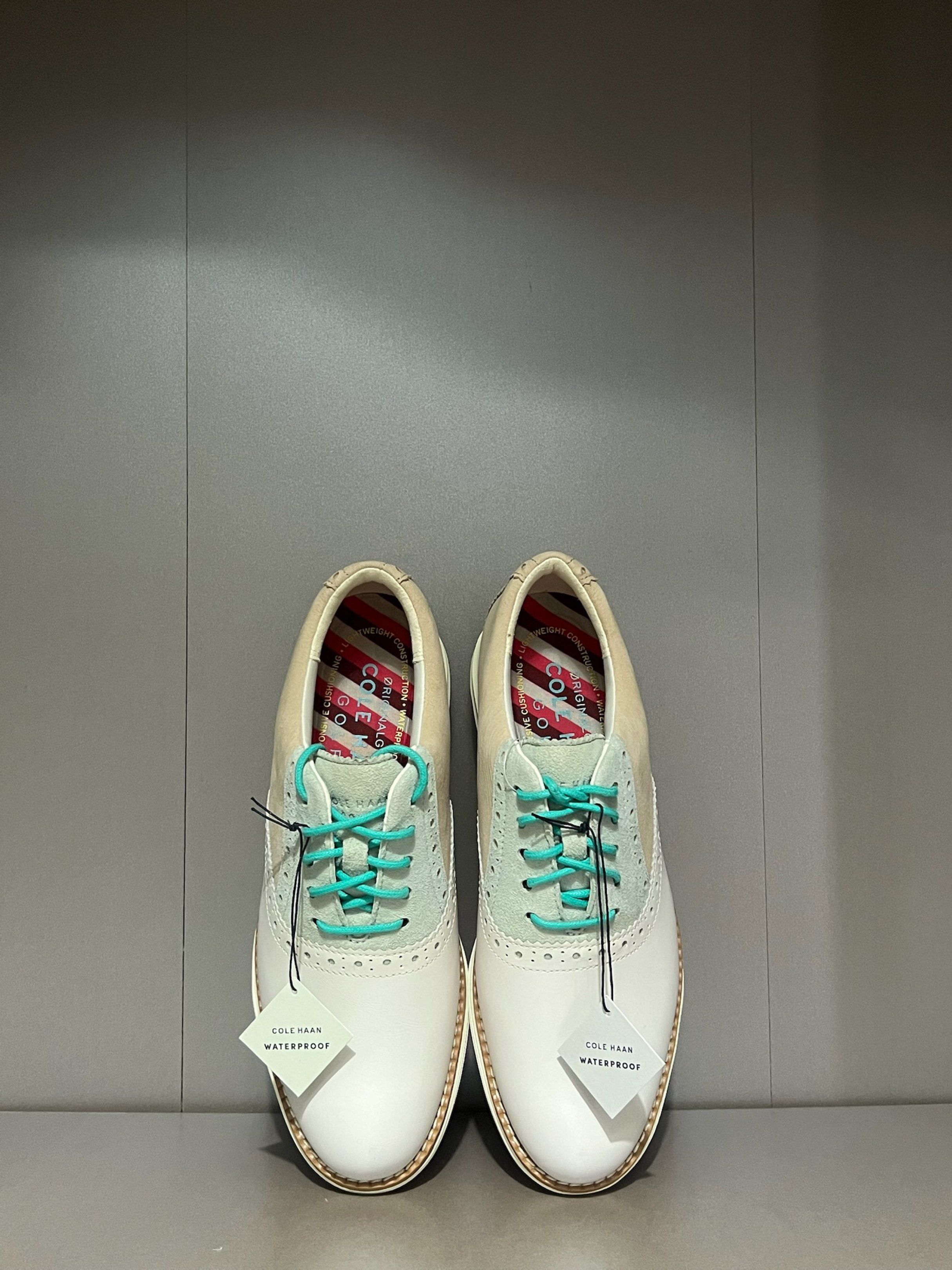 Cole Haan Waterproof Golf Shoes (Category: Golf) located in Quezon City. Submitted by shoppaloco (Listing ID 1418598407, Image 2). Description: - Cole Haan waterproof golf shoes - White and beige leather upper - Turquoise laces and accents - Pink and white sole - Includes original tags - Classic saddle shoe design - 36 EU .