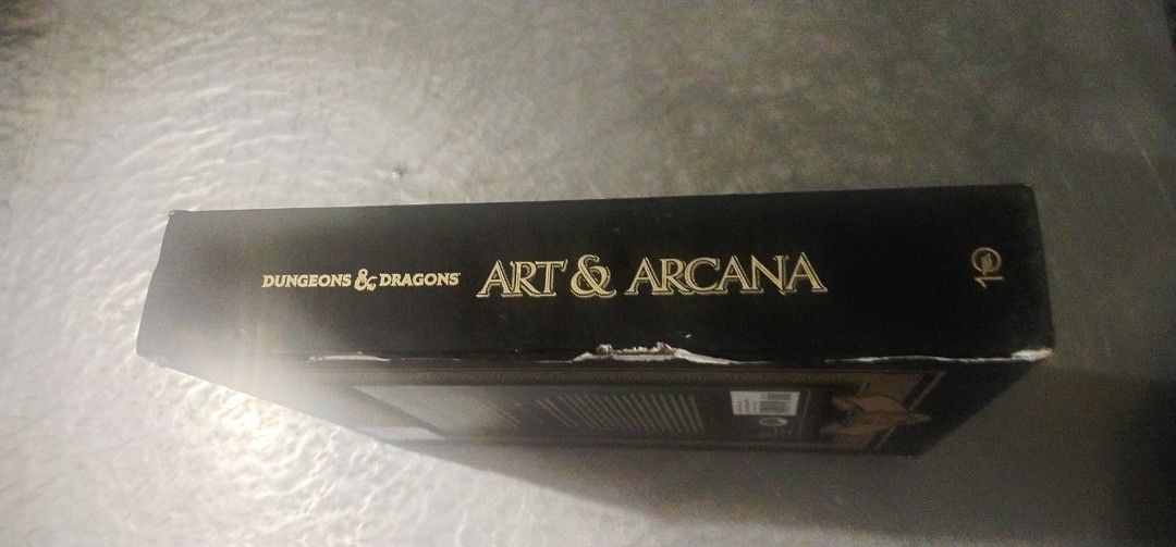 Dungeons & Dragons Art & Arcana Book (Category: Storybooks) located in Muntinlupa City. Submitted by grayfox05 (Listing ID 1418712847, Image 2). Description: for sale Dungeons & Dragons Art & Arcana Book...5000 pesos with issue lng po sa box..almost new po un book..me kulang lng po sa insert n art pero un mismong book mint condition po..unread po sya.. WYSIWYG.