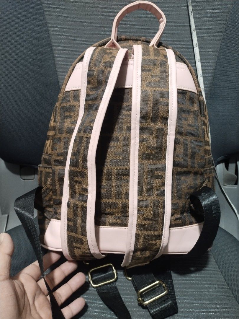 fendi backpack (Category: Backpacks) located in Baguio. Submitted by roozeydluc (Listing ID 1418732435, Image 3). Description: canvas material large size L:10.5" W:5.2" H: 🔎mga small tuklap sa leatherette na accent nya ✓1 zippered compartment with 1 open inside pocket ✓1 zippered front pocket.