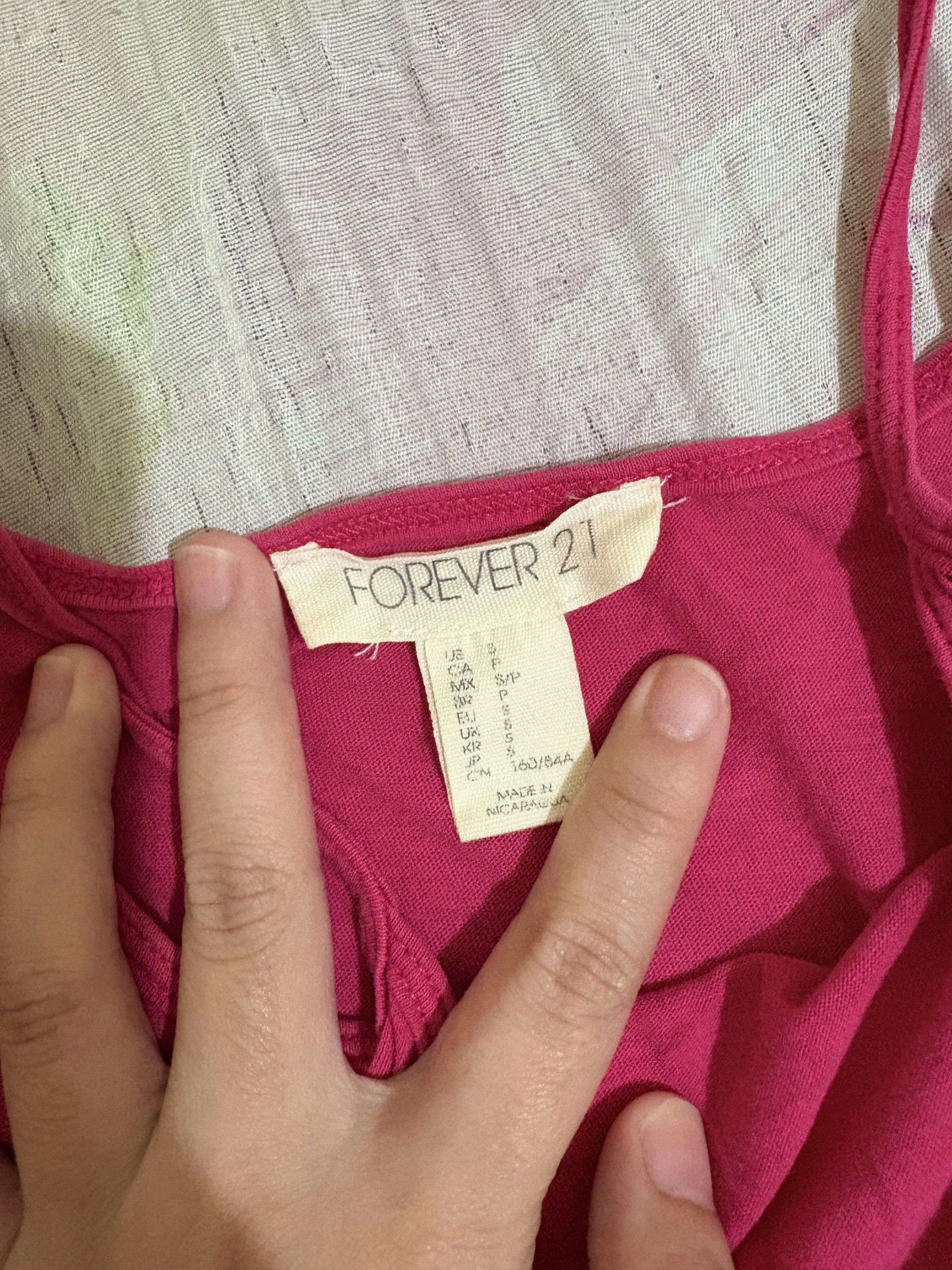 forever 21 hot pink tank top (Category: Sleeveless) located in Bulacan. Submitted by seikariiii (Listing ID 1418618763, Image 2). Description: small a bit loose 60 + sf/same say delivery.