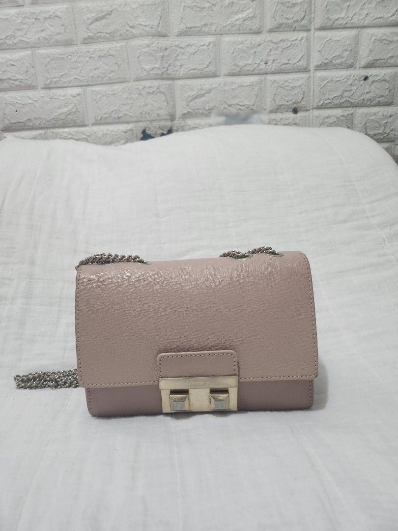 Furla Pink Bella Bag (Category: Luxury Bags & Wallets) located in Valenzuela. Submitted by aleecu (Listing ID 1418613048, Image 1). Description: valenzuela loc. no used, as seen sa pic. rfs: not using anymore, declutter - Authentic Furla shoulder bag - Elegant flap closure with metal clasp - Chic chain strap - Stunning pink leather exterior - Interior with multiple compartments - Light green interior lining - Includes original Furla brand tag.