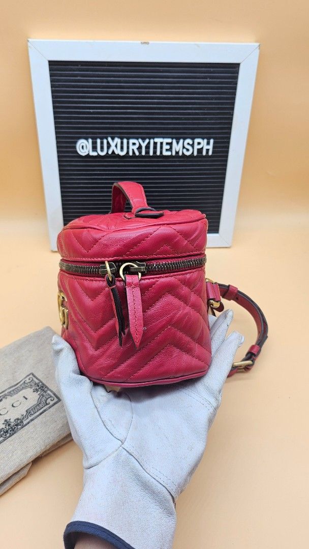 Gucci GG Marmont Mini Backpack (Category: Luxury Bags & Wallets) located in Pamplona. Submitted by luxuryitems_ph (Listing ID 1418681813, Image 2). Description: - Authentic Gucci GG Marmont Mini Backpack - Crafted in red quilted leather - Features: - Top handle - Adjustable shoulder straps - Zip closure - Iconic GG logo on the front - Interior includes a small pocket - Includes authenticity cards .