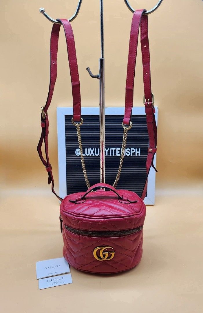Gucci GG Marmont Mini Backpack (Category: Luxury Bags & Wallets) located in Pamplona. Submitted by luxuryitems_ph (Listing ID 1418681813, Image 1). Description: - Authentic Gucci GG Marmont Mini Backpack - Crafted in red quilted leather - Features: - Top handle - Adjustable shoulder straps - Zip closure - Iconic GG logo on the front - Interior includes a small pocket - Includes authenticity cards .
