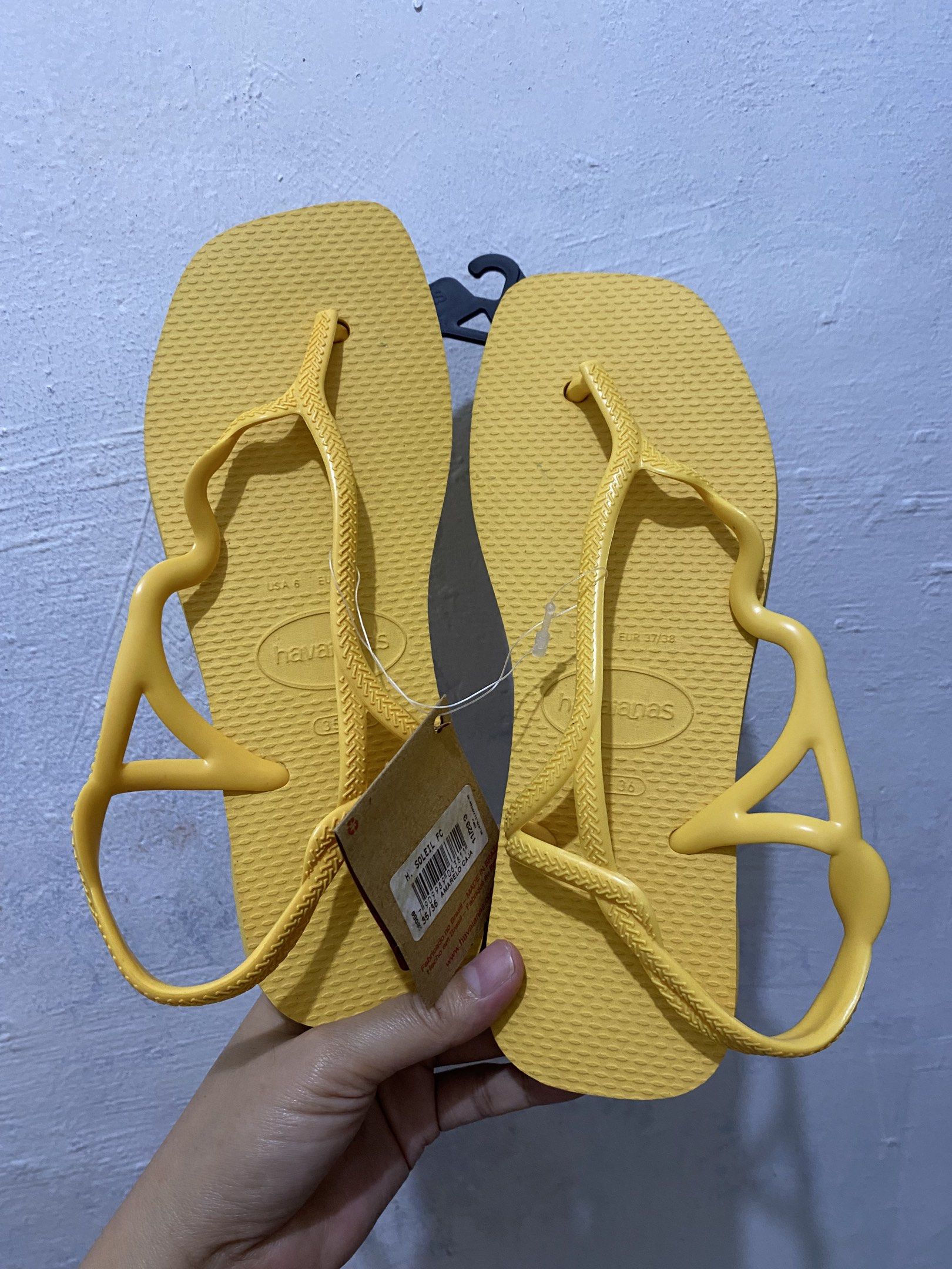 Havaianas You St Tropez Yellow Flip-flops (Category: Slippers and slides) located in Makati City. Submitted by tsa_tym (Listing ID 1418653241, Image 2). Description: - Bright yellow Havaianas flip-flops - US size 6 - Unique strap design - Includes original tag - Comfortable and stylish - Perfect for beach or casual wear.