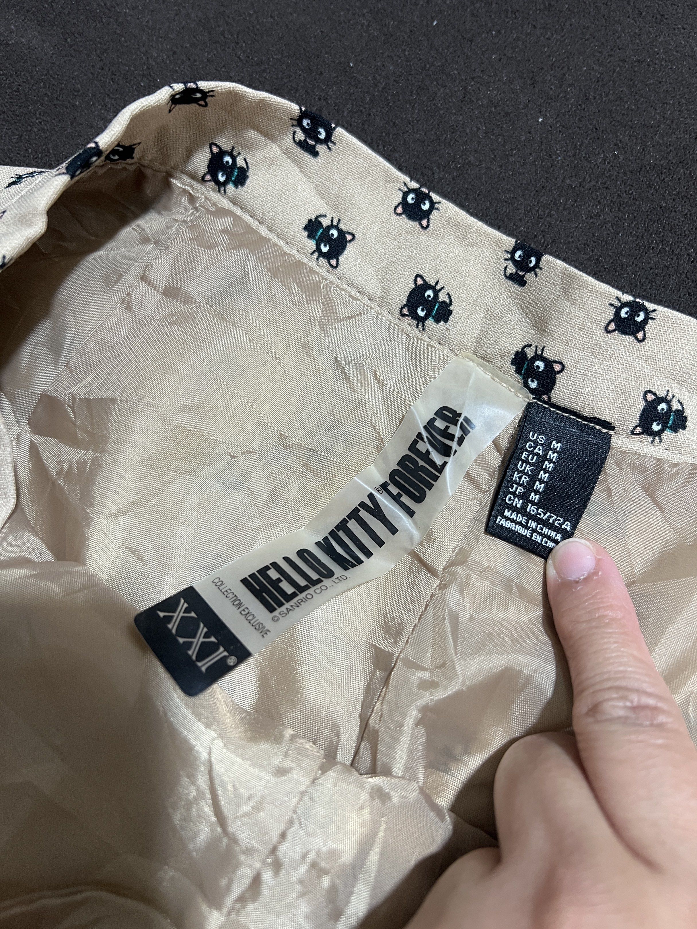 Hello Kitty Forever Shorts - Size M (Category: Shorts) located in Bacoor. Submitted by pktd10 (Listing ID 1418724107, Image 2). Description: - Kitty Forever shorts - Size: M - Features an all-over Kitty print - Color: Beige background with dark blue Kitty pattern - Design: High-waisted.