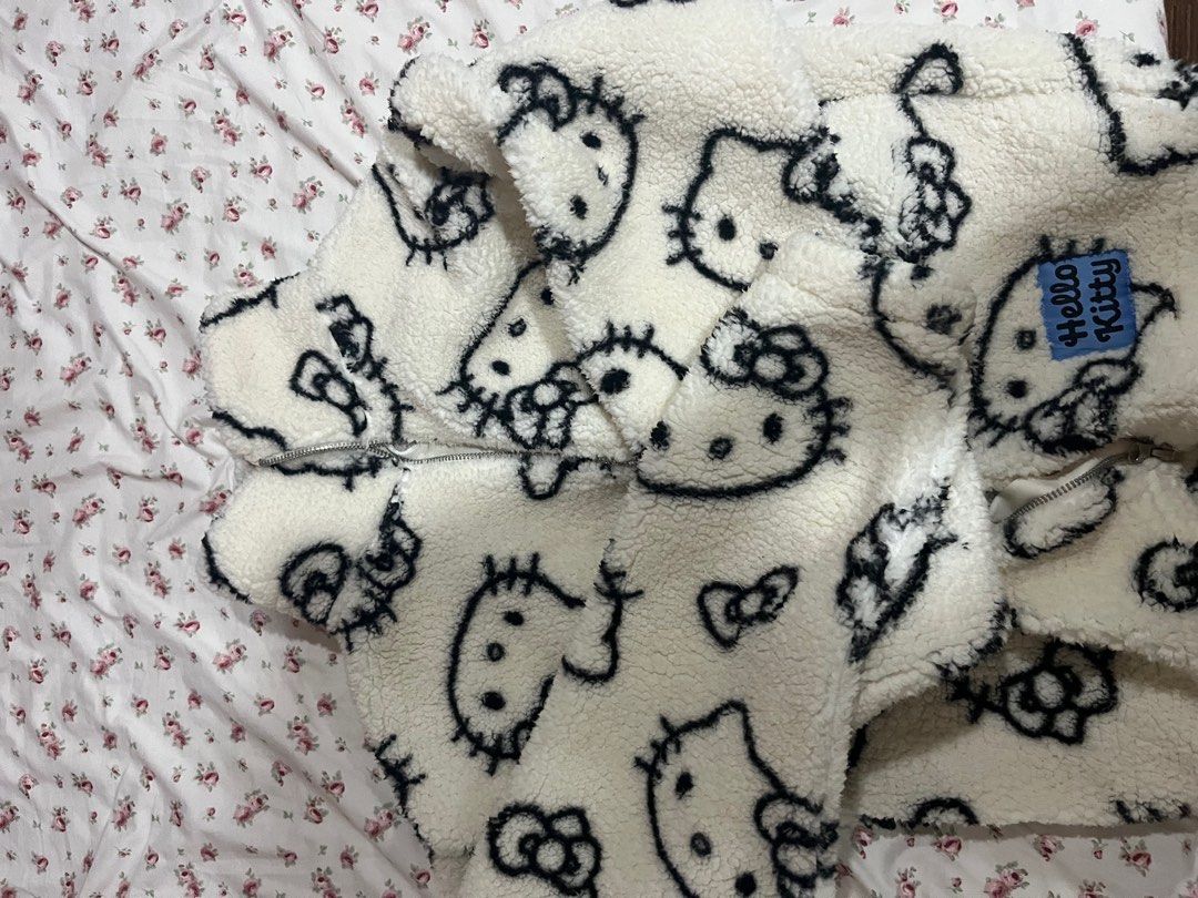 H&M Hello Kitty Fleece Jacket (Category: Coats, Jackets and Outerwear) located in Angeles City. Submitted by luvmazzystar (Listing ID 1418639708, Image 3). Description: - H&M Kitty Jacket - Features a fun Kitty print - Soft, fleece-like texture - Color: White with black Kitty designs - Zip-up front - Includes a small Kitty tag - Size: EUR 158/64, US 16/16, AUS 13-14 SRP : 699.
