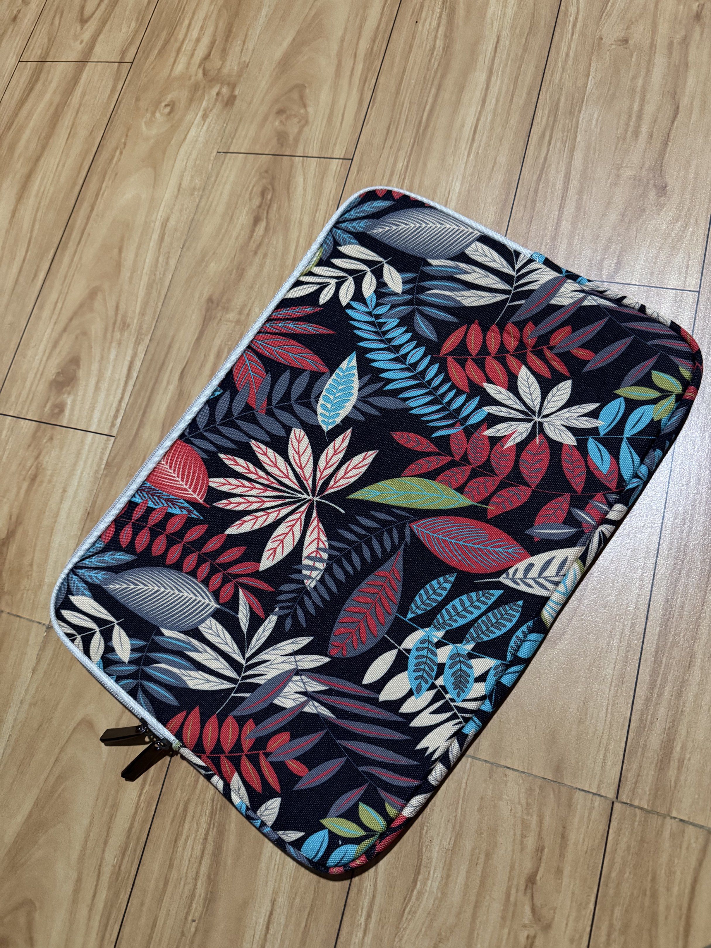 Laptop Sleeve - 15inch (Category: Laptop Bags & Sleeves) located in Mabalacat. Submitted by shoparchivedpieces (Listing ID 1418734793, Image 2). Description: - Brand new 15-inch laptop sleeve - Features a colorful leaf design - Shipping via J&T (c/o buyer) - Meetups available in Mabalacat City.