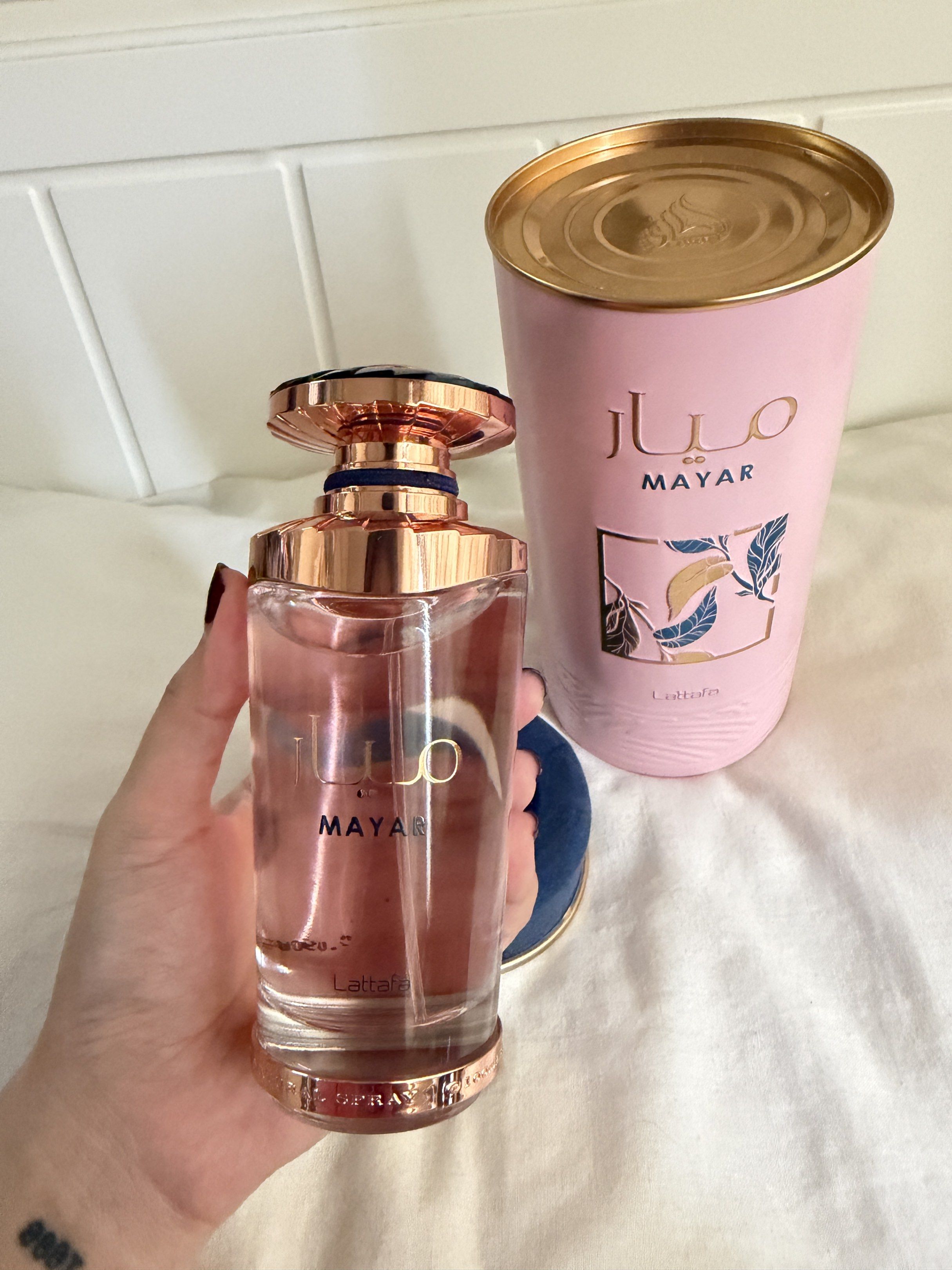 Lattafa Mayar Eau de Parfum (Category: Fragrance & Deodorants) located in Manila. Submitted by sashimille (Listing ID 1418609092, Image 3). Description: - Lattafa Mayar Eau de Parfum - Comes in a pink bottle with a gold cap. - Presented in a matching pink can. - Box features the name "Mayar" in both Arabic and English. - The perfume has a light pink color. - Said to be a dupe of Mugler Angel Nova.