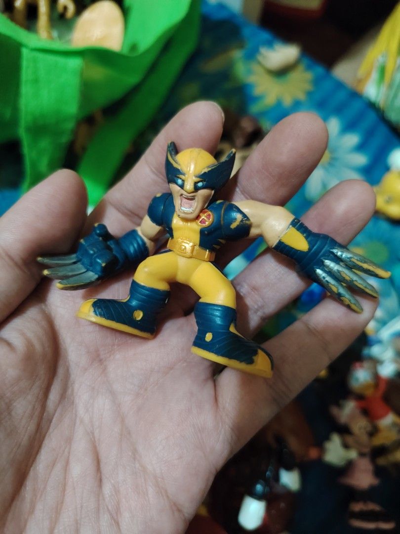 Marvel Wolverine Action Figure (Category: Figurines & Statues) located in Iligan City. Submitted by shehabdor98515 (Listing ID 1418768276, Image 1). Description: Wolverine action figure. It features the classic yellow and blue costume with claws extended. The figure is in a dynamic pose, ready for action. The figure is made of plastic and has detailed paintwork..