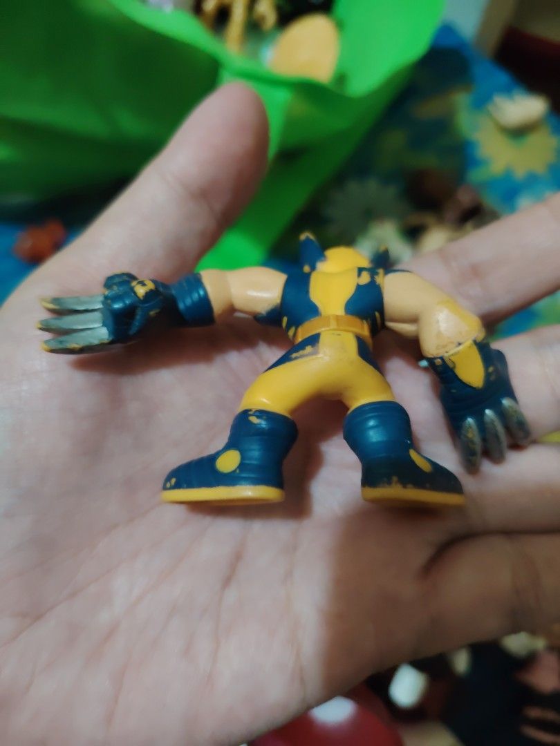 Marvel Wolverine Action Figure (Category: Figurines & Statues) located in Iligan City. Submitted by shehabdor98515 (Listing ID 1418768276, Image 2). Description: Wolverine action figure. It features the classic yellow and blue costume with claws extended. The figure is in a dynamic pose, ready for action. The figure is made of plastic and has detailed paintwork..
