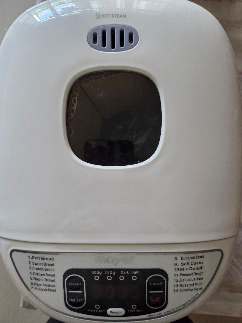 Mayer Multi-Function Bread Maker (MMSM12) (Category: Breadmakers) located in Singapore. Submitted by bravemountain.321001 (Listing ID 1418618124, Image 3). Description: Mayer BRAND NEW IN BOX multi-function bread maker. Features 14 baking functions, including soft bread, French bread, and jam. Makes 750g loaves. Includes a digital display and various settings for crust color and weight. Comes with original box. .