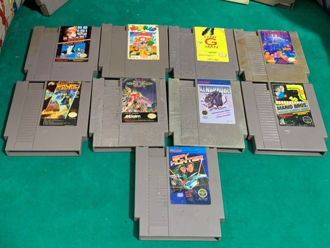 NES Game Cartridges - Assorted Titles (Category: Nintendo) located in Manila. Submitted by miah_collectiblesurplus (Listing ID 1418724366, Image 2). Description: 10,000 pesos Location: Valenzuela VINTAGE NES GAMES Tested working yung 9pcs na nakahiga Yung 5pcs na nakasandal di maread baka need linis di ko alam kayo na bahala sama ko na.