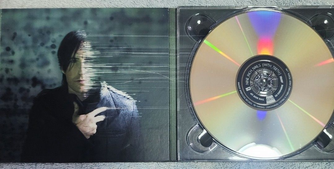 Nine Inch Nails – With Teeth (Category: CDs & DVDs) located in Cebu City. Submitted by g_roshamboo (Listing ID 1222818596, Image 3). Description: cd/dvd digipak.