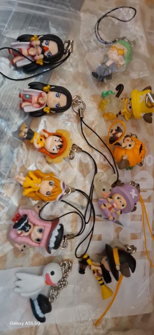 One Piece Keychain Collection (Category: Character Goods) located in Quezon City. Submitted by apple.ordinario (Listing ID 1418697844, Image 3). Description: - One Piece character keychains. - Includes Luffy, Boa Hancock, Nami, and Chopper. - Detailed character designs. - Comes with a strap for easy attachment. - Perfect for bags, keys, and collectibles..