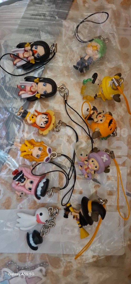 One Piece Keychain Collection (Category: Character Goods) located in Quezon City. Submitted by apple.ordinario (Listing ID 1418697844, Image 2). Description: - One Piece character keychains. - Includes Luffy, Boa Hancock, Nami, and Chopper. - Detailed character designs. - Comes with a strap for easy attachment. - Perfect for bags, keys, and collectibles..