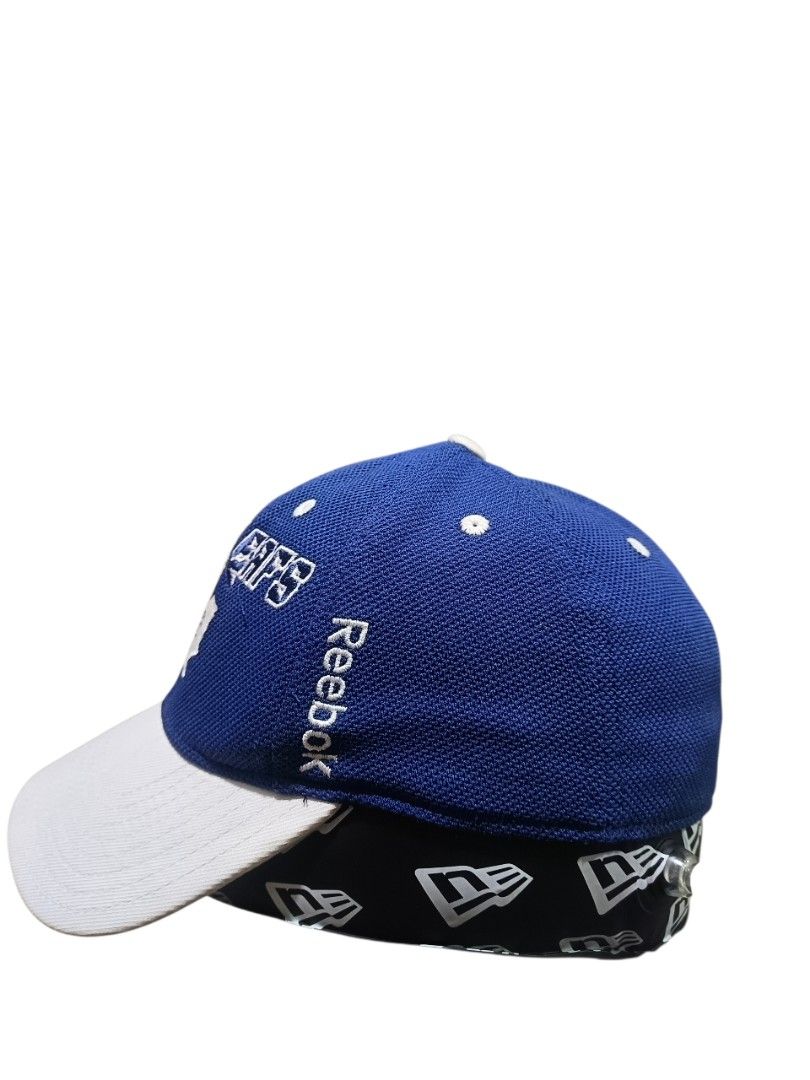 Reebok Toronto Maple Leafs Cap (Category: Caps & Hats) located in General Santos City (Dadiangas). Submitted by _jackeith (Listing ID 1418743279, Image 3). Description: -Cap features the Toronto Maple Leafs logo on the front. -It has a blue crown and a white brim. The cap is made by Reebok and has the NHL logo on the back. -The size is S/M. -The cap is part of the Center Ice Collection..
