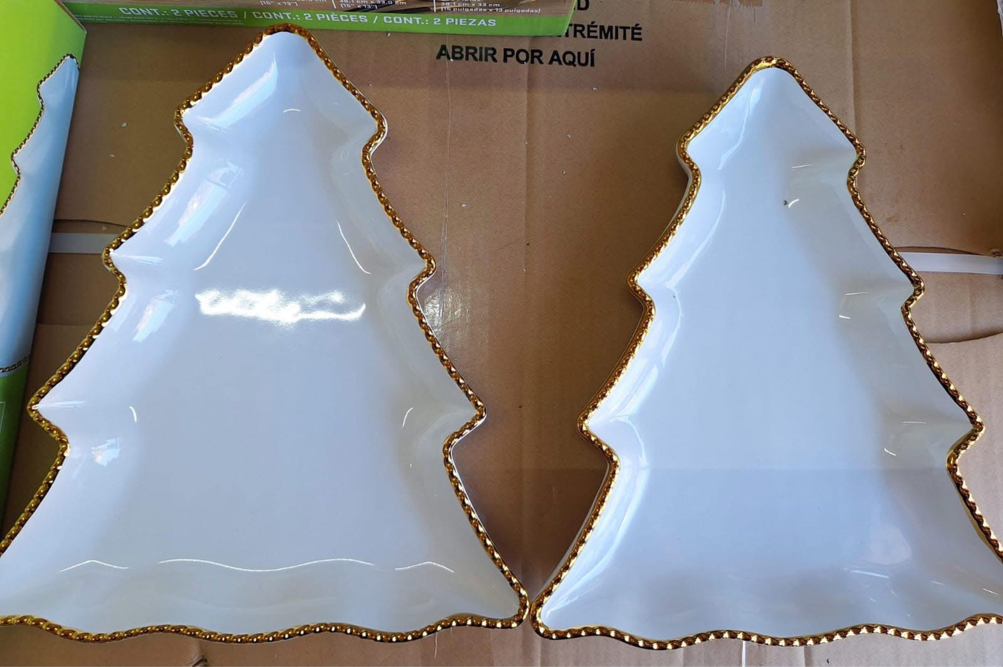 Signature 2-Piece Christmas Tree Serving Platters (Category: Dinnerware & Cutlery) located in Manila. Submitted by silverwater.8567f2 (Listing ID 1418617647, Image 2). Description: - Set of 2 serving platters - Christmas tree shape - White surface with gold beaded trim - Perfect for appetizers and desserts - Festive touch for holiday gatherings.