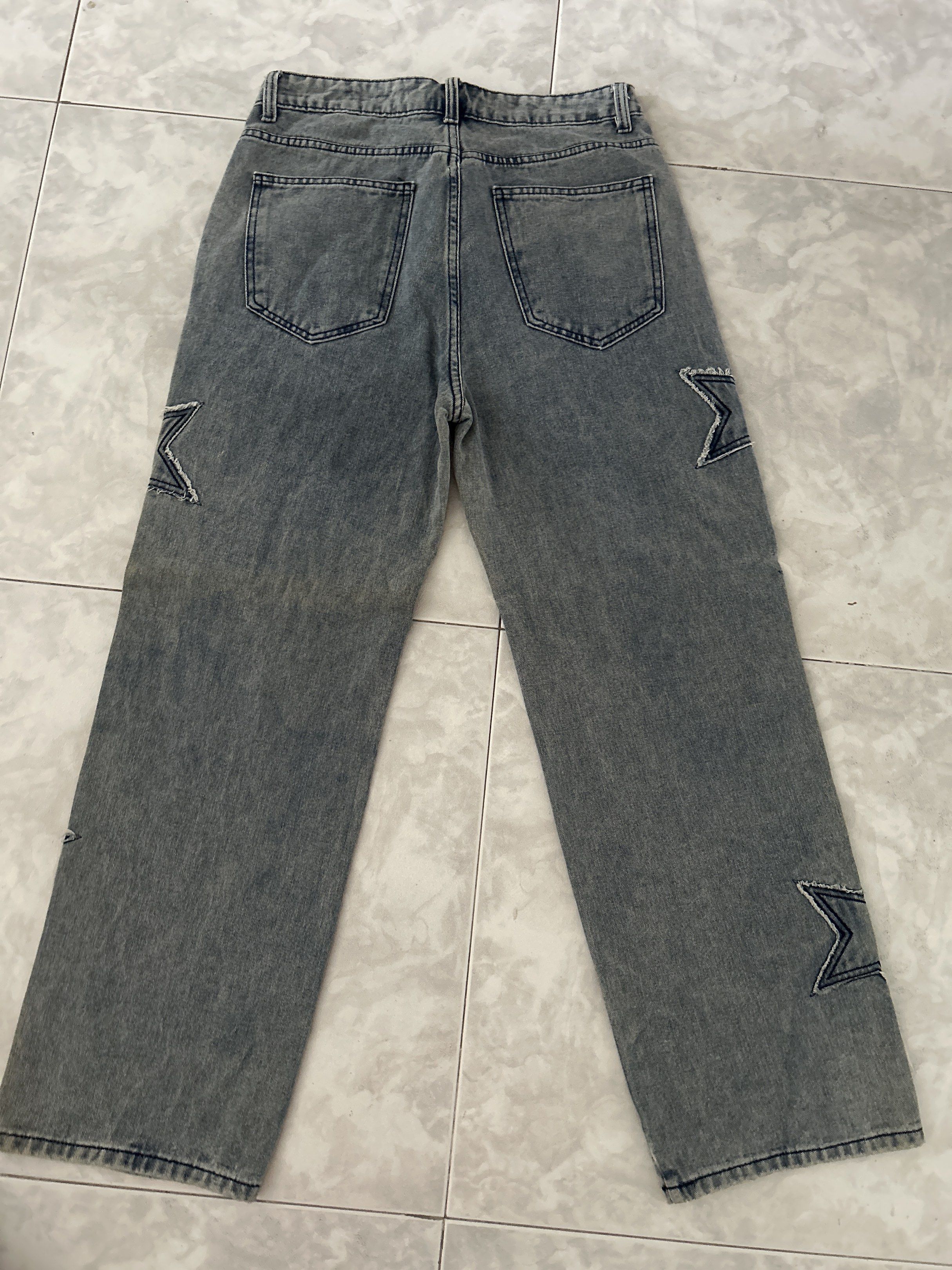 Star Patchwork Jeans (Category: Jeans & Leggings) located in Singapore. Submitted by pipispipi (Listing ID 1418637814, Image 2). Description: - Stylish blue jeans - Star patchwork design - Straight leg fit - Brand new.