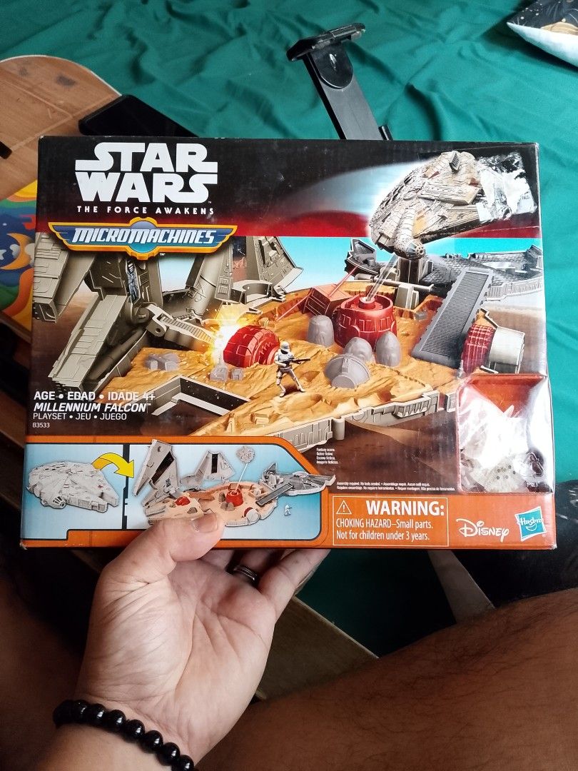 Star Wars Micro Machines Millennium Falcon Playset (Category: Action & Battle Toys) located in Quezon. Submitted by lled23 (Listing ID 1418625408, Image 1). Description: - Star Wars Micro Machines Millennium Falcon playset - From The Force Awakens series - Features the Millennium Falcon transforming into a playset - Includes various vehicles and figures - Hasbro product - Box shows other Micro Machines sets.