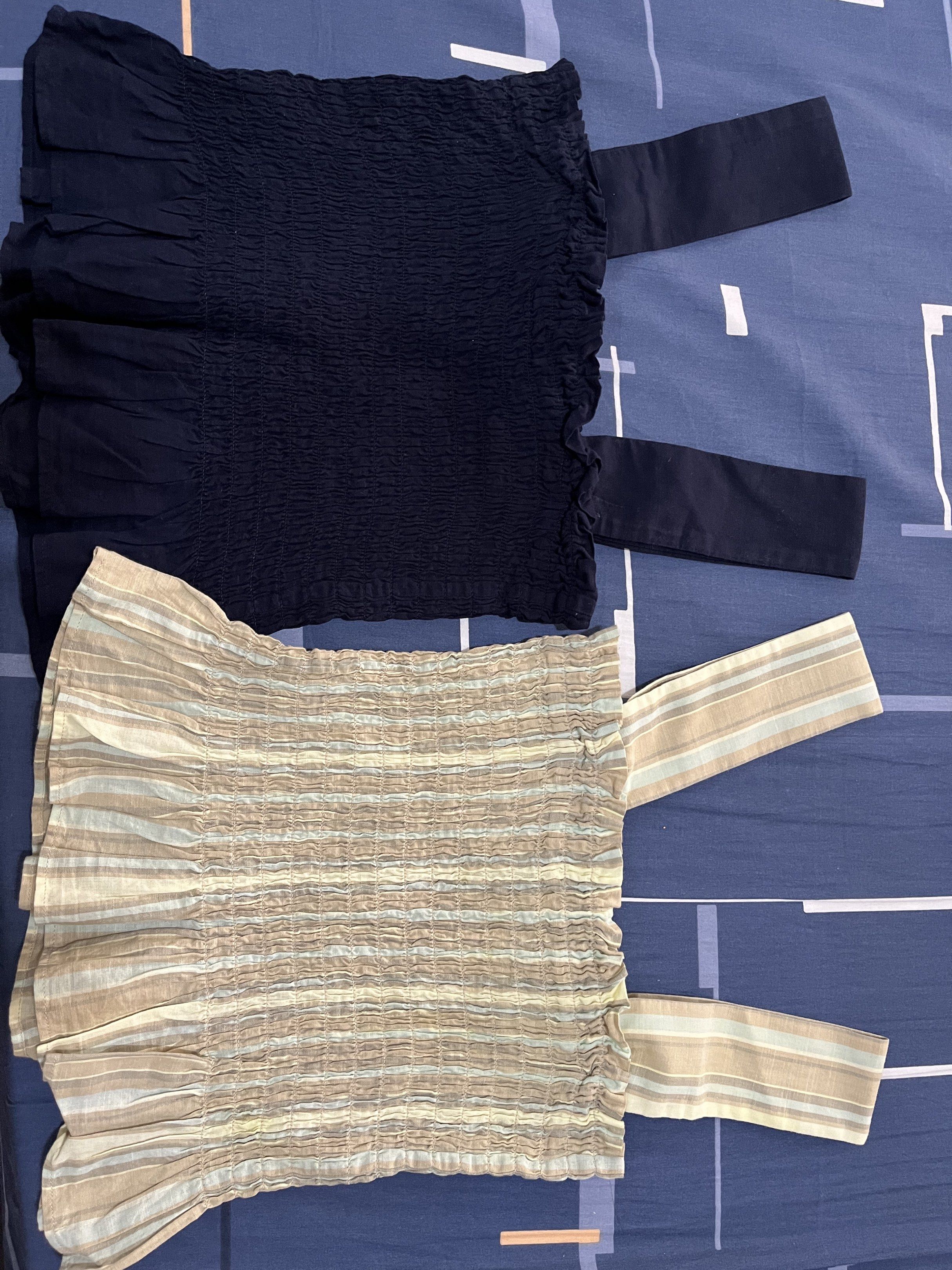 Uniqlo Smocked Off-Shoulder Top (Category: Blouses) located in Las Pinas. Submitted by sortandsimplify (Listing ID 1418598889, Image 1). Description: - Smocked off-shoulder design - Available colors: navy blue and striped beige - Navy blue top features button detail on strap - Size: Small -m.