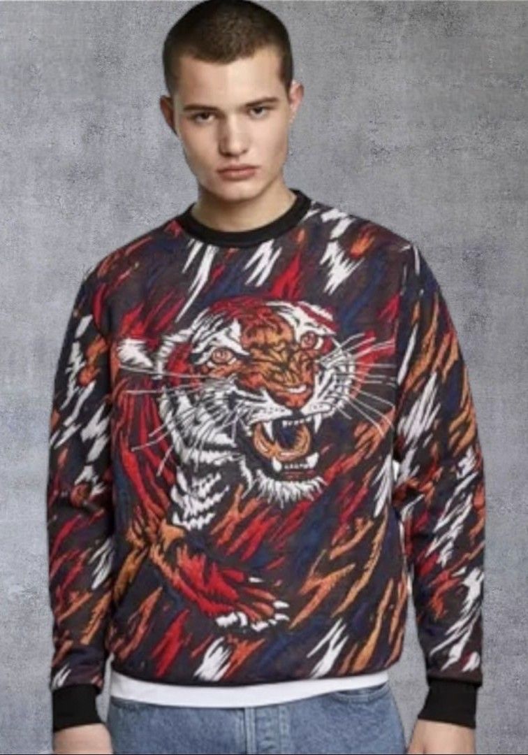 Vintage Zara Tiger Sweatshirt (Category: Coats, Jackets and Outerwear) located in Quezon City. Submitted by randy.listen (Listing ID 1418656573, Image 2). Description: - Zara tiger print sweatshirt - Crew neck - Long sleeves with ribbed cuffs - Features a vibrant tiger face design - Includes Zara dust bag - Unworn condition.