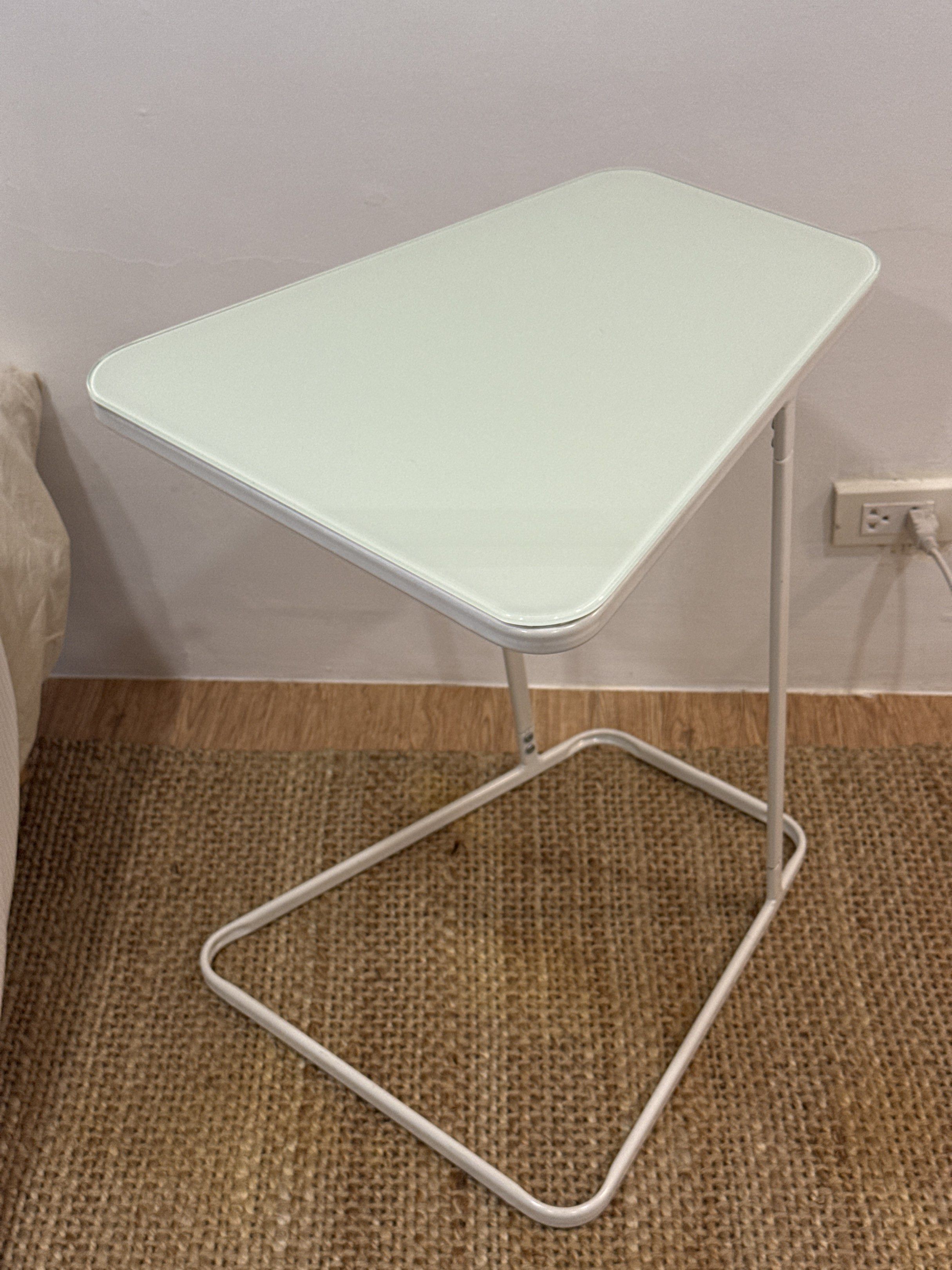 White Side Table with Glass Top (Category: Tables & Sets) located in Marikina City. Submitted by kbarellano (Listing ID 1418681235, Image 1). Description: – Selling 2 units, ₱1,500 each - Originally bought for ₱2,500 from Furniture Source - Tempered painted glass – Curved edge table – Epoxy coating leg Width: 52 cm Depth: 44 cm Height: 62 cm.