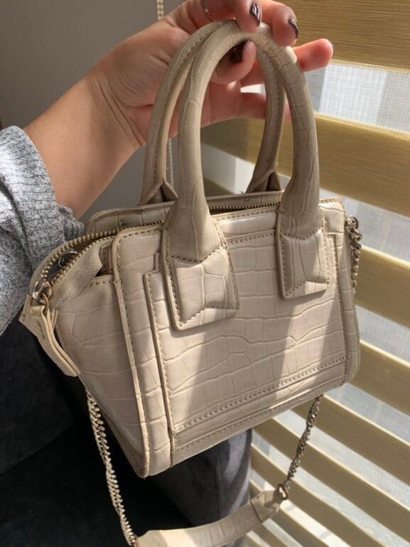 Zara Mini City Bag with Chain (Category: Luxury Bags & Wallets) located in Tagum. Submitted by bernardino49694 (Listing ID 1418643340, Image 1). Description: - Zara Mini City Bag - Crocodile-embossed design - Top handle and detachable chain strap - Zippered main compartment - Small interior pocket - Neutral color, easy to pair - Zara label inside.