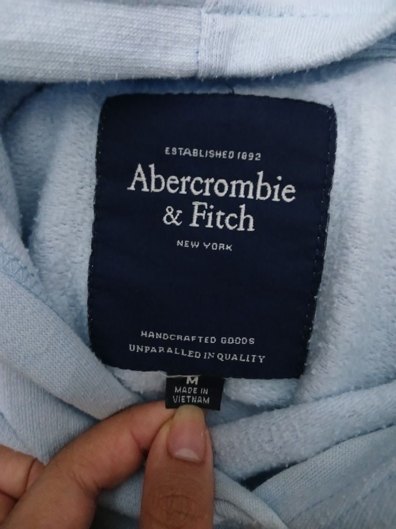 Abercrombie & Fitch Hoodie - Medium (Category: Coats, Jackets and Outerwear) located in Caloocan City. Submitted by 11declutter_master11 (Listing ID 1418892740, Image 2). Description: - Abercrombie & Fitch hoodie - Light blue color - Size says M but it's a tight fit for me (my dimensions in my profile - Unisex.