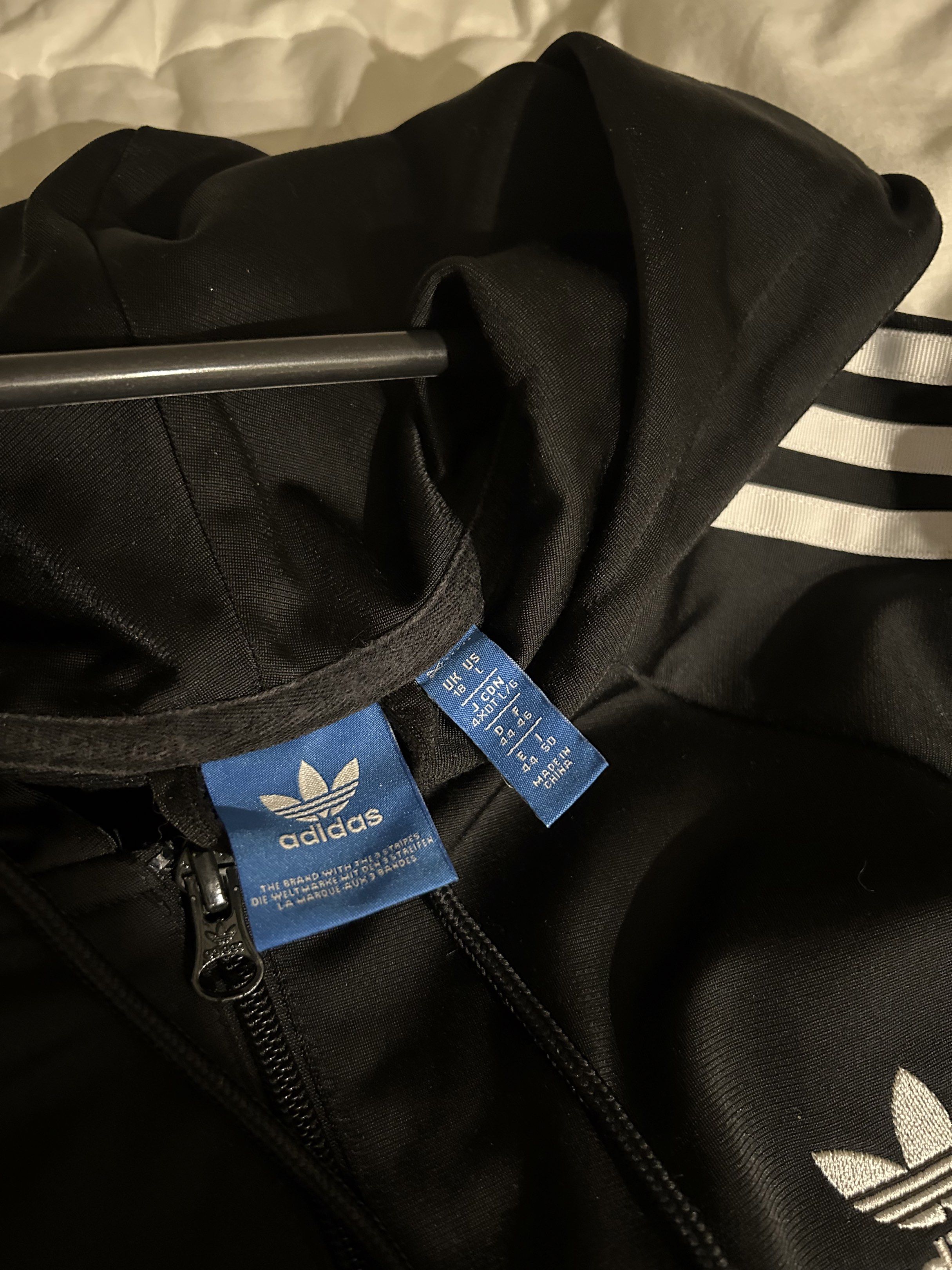 Adidas Black Hoodie Jacket Three Stripes (Category: Coats, Jackets and Outerwear) located in Calamba. Submitted by baskybears (Listing ID 1418923663, Image 3). Description: - Adidas hoodie jacket - Black with white stripes on sleeves - Full zip closure - Hooded.