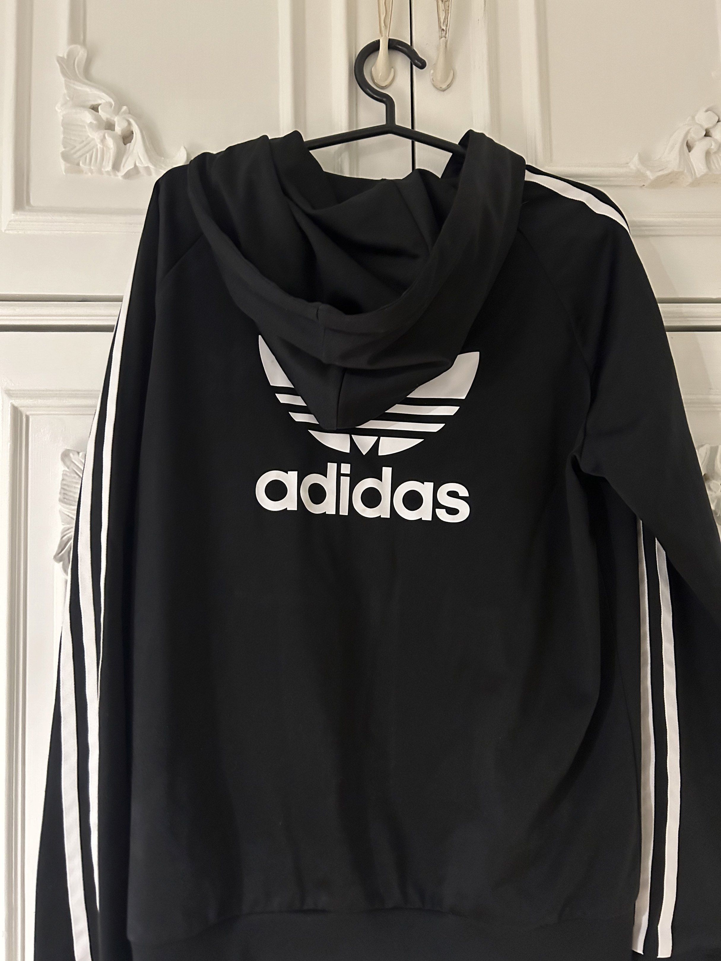 Adidas Black Hoodie Jacket Three Stripes (Category: Coats, Jackets and Outerwear) located in Calamba. Submitted by baskybears (Listing ID 1418923663, Image 2). Description: - Adidas hoodie jacket - Black with white stripes on sleeves - Full zip closure - Hooded.