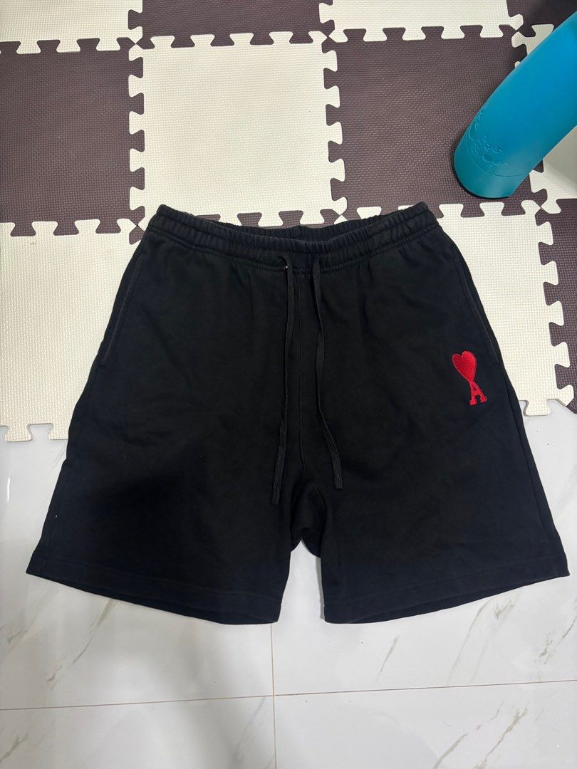 AMI Paris Black Shorts (Category: Shorts) located in Baguio. Submitted by usedcondition (Listing ID 1418836509, Image 1). Description: - Black AMI Paris shorts - Red heart logo on left leg - Drawstring waistband - Size: Large - Made in China 30-32 waist 20” length.