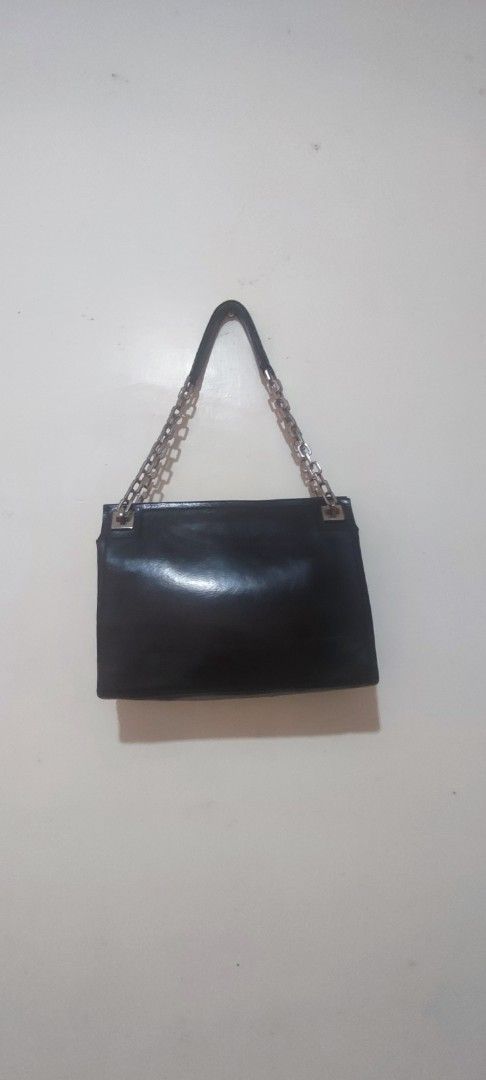Bally Black Leather Chain Bag (Category: Luxury Bags & Wallets) located in Caloocan City. Submitted by guiltypleasures75 (Listing ID 1418873179, Image 2). Description: - Authentic Bally Vintage shoulder bag - Black leather exterior - Silver chain straps - Rectangular shape - Top handle - Shiny finish - Silver hardware - Bally brand visible inside.