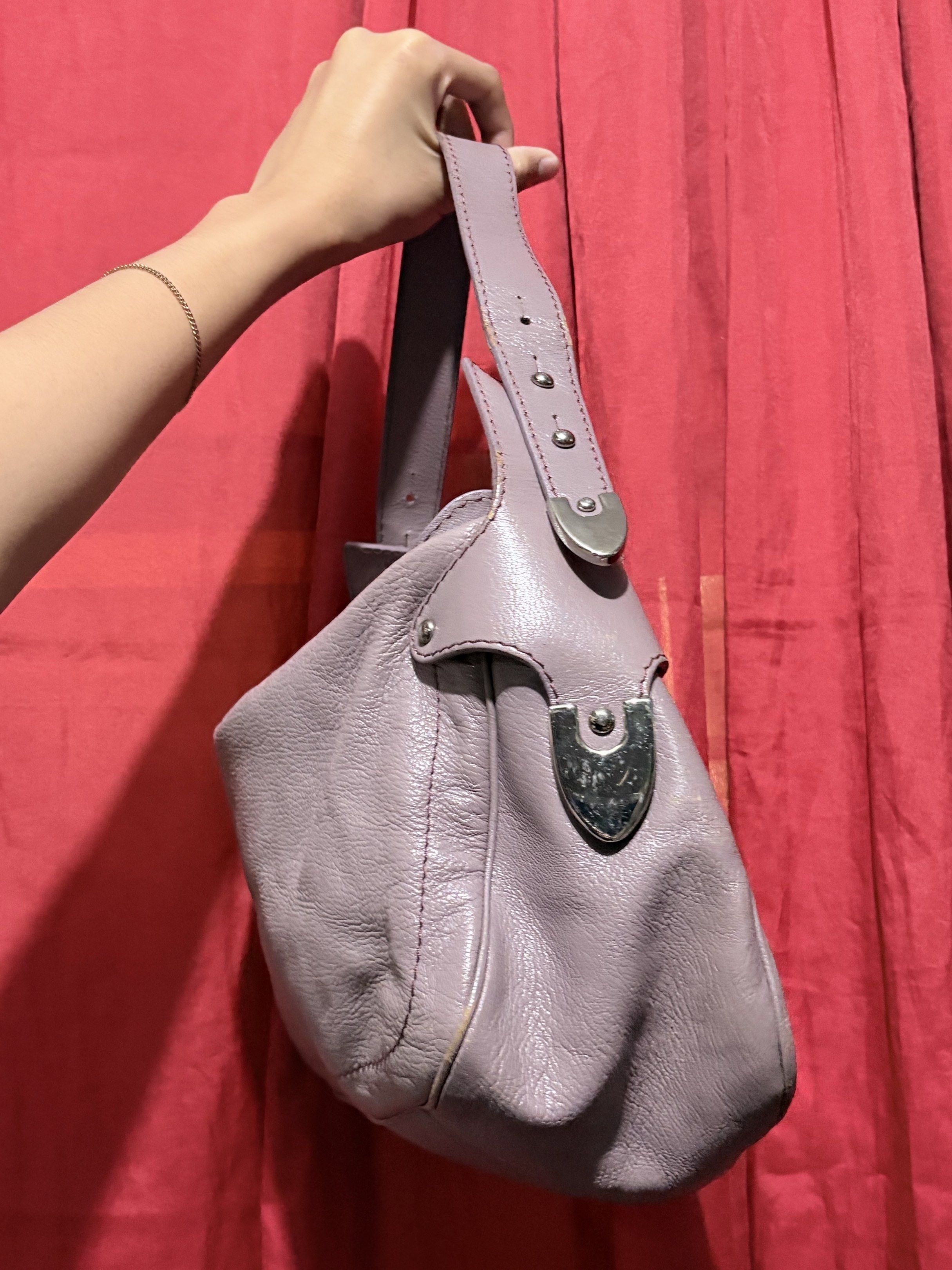 Bally Shoulder Bag (Category: Luxury Bags & Wallets) located in Manila. Submitted by cufflej (Listing ID 1418956936, Image 3). Description: - Lavender Bally shoulder bag - Top zipper closure - Single shoulder strap - Silver-tone logo - Brown fabric lining - Silver-tone Bally metal tag - Curved shape - Leather exterior.