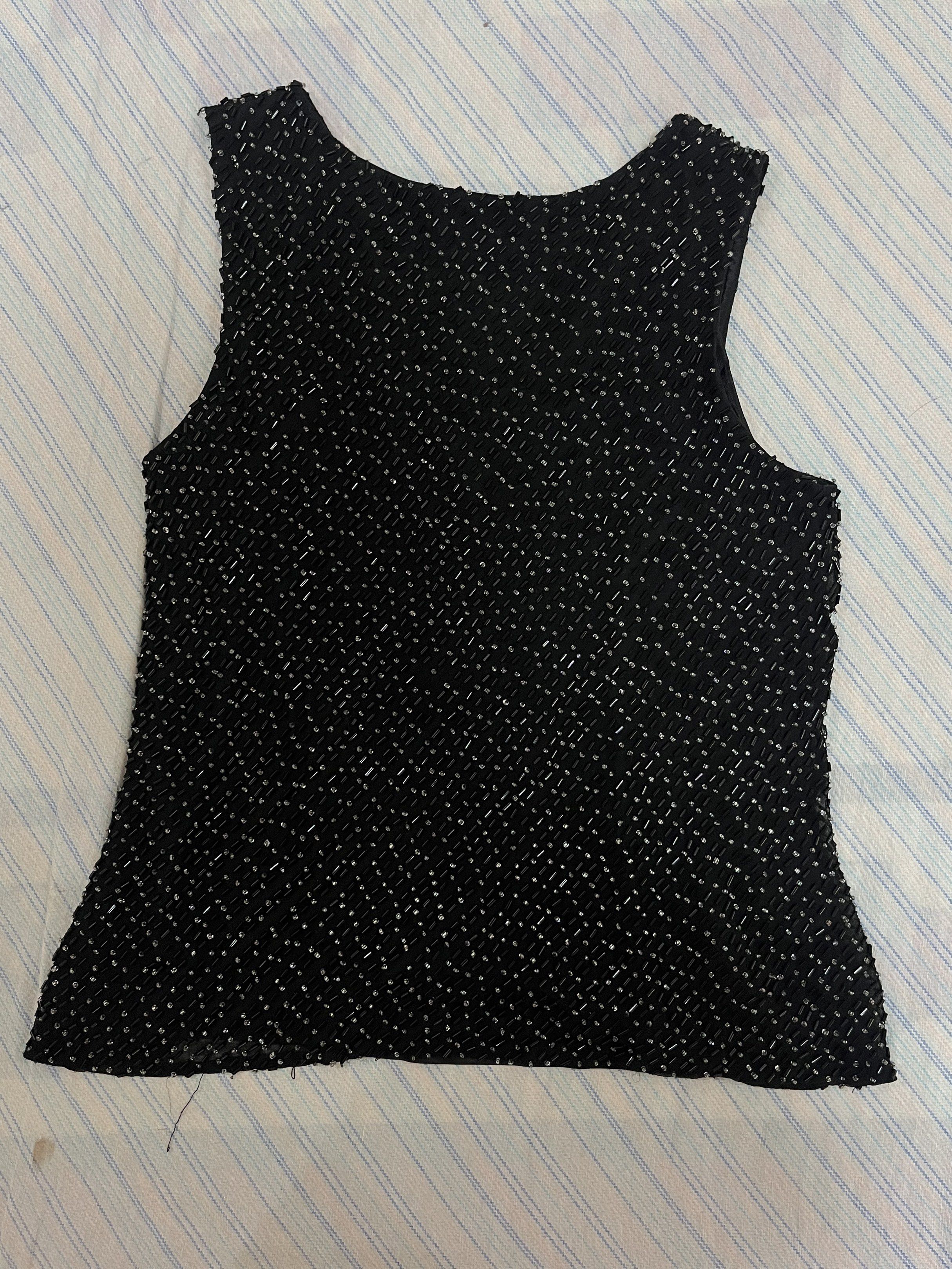 Fully Beaded Clubbing Sleeveless Top (Category: Sleeveless) located in Quezon City. Submitted by mikaaii (Listing ID 1418845487, Image 2). Description: Black fully beaded sleeveless top perfect for parties, clubbing, and drinks! Issues: Some loose threads but otherwise the beading is complete naman. RFS: Too small for me:( so no when worn pics! .