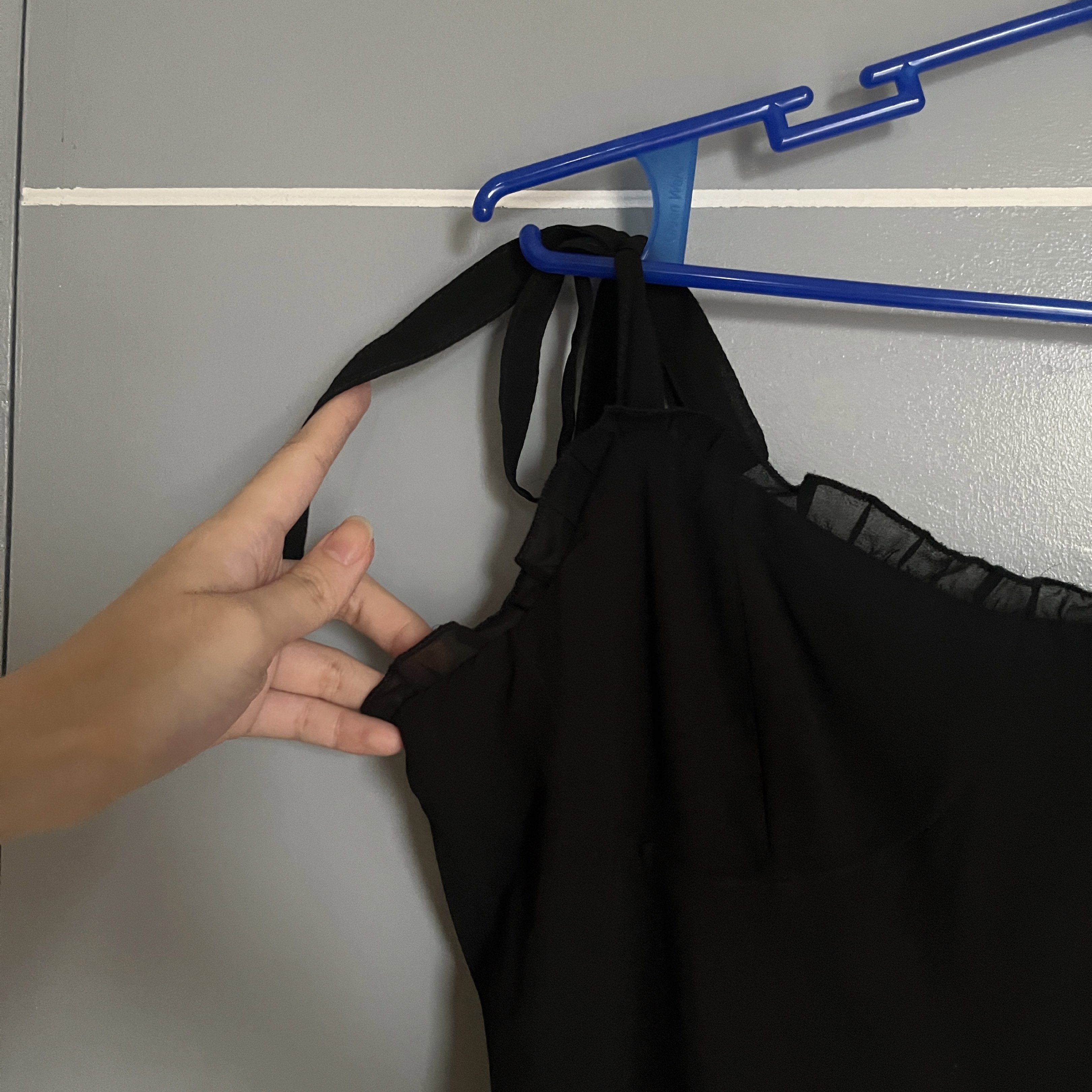 Black Tie-Strap Dress (Category: Dresses) located in Taguig. Submitted by _handydandy (Listing ID 1418905974, Image 3). Description: - Black dress with tie straps - Size small - medium - Used twice; then kept in storage - Super presko; lightweight fabric - Ruffled neckline and hem - Fitted bodice, flowing skirt - Lightweight, draping fabric - Versatile for various occasions.