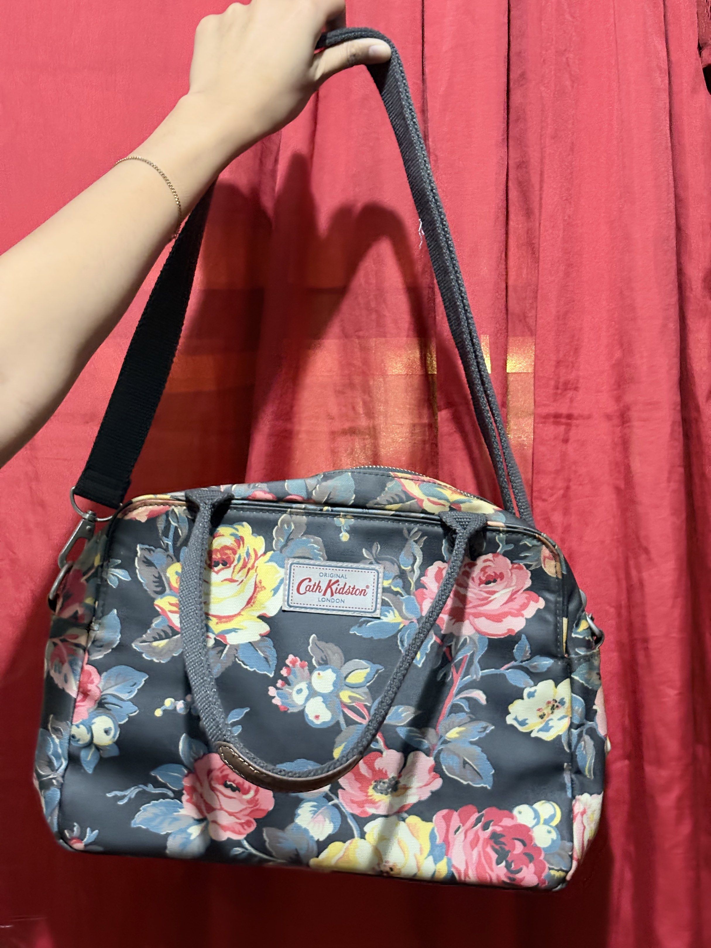 Cath Kidston Floral Handbag with Shoulder Strap (Category: Shoulder Bags) located in Manila. Submitted by cufflej (Listing ID 1418958137, Image 2). Description: - Authentic Cath Kidston handbag - Beautiful floral pattern - Top handle and detachable shoulder strap - Multiple interior compartments - Floral interior lining - Leather handle accents.