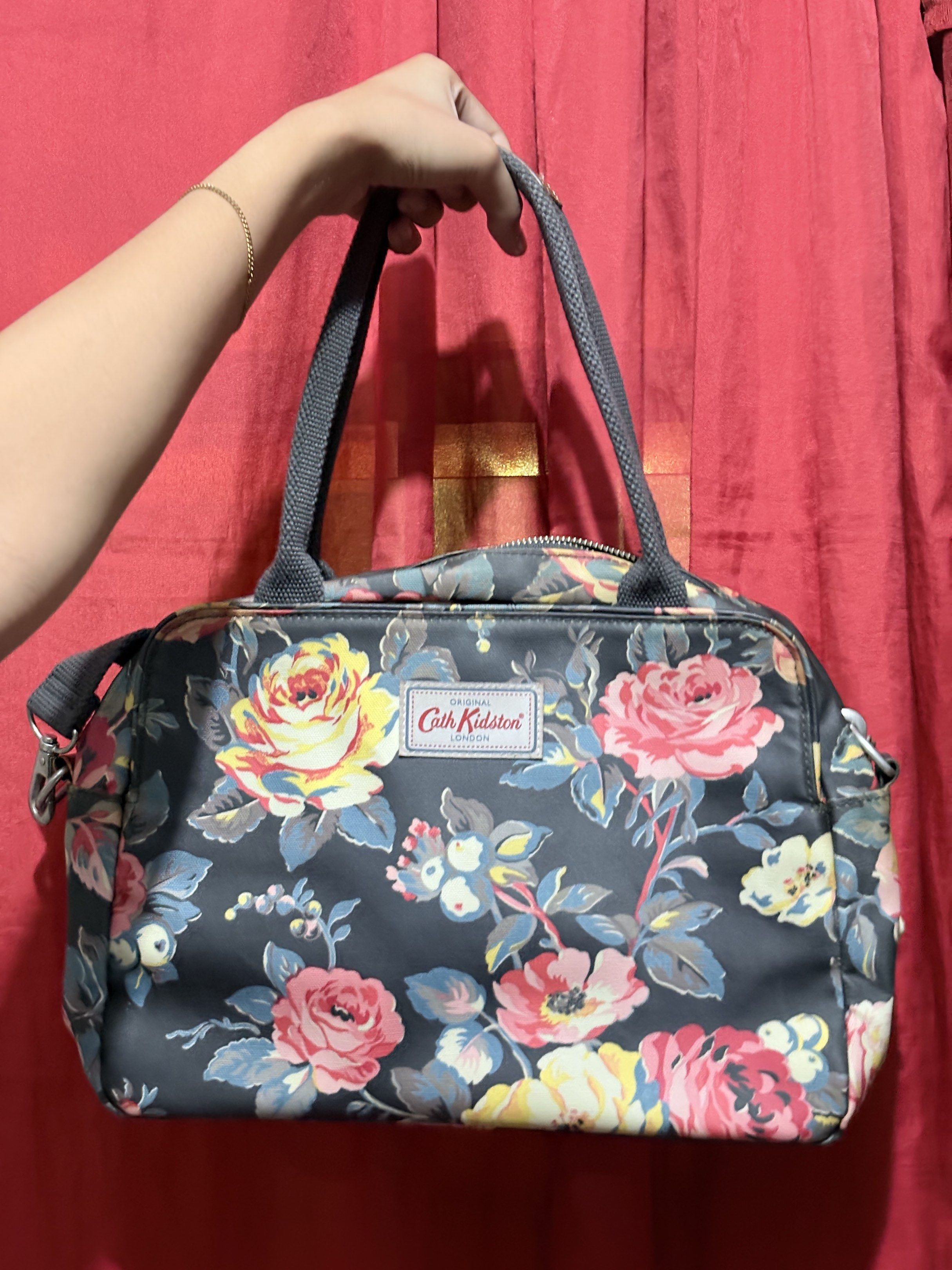 Cath Kidston Floral Handbag with Shoulder Strap (Category: Shoulder Bags) located in Manila. Submitted by cufflej (Listing ID 1418958137, Image 1). Description: - Authentic Cath Kidston handbag - Beautiful floral pattern - Top handle and detachable shoulder strap - Multiple interior compartments - Floral interior lining - Leather handle accents.