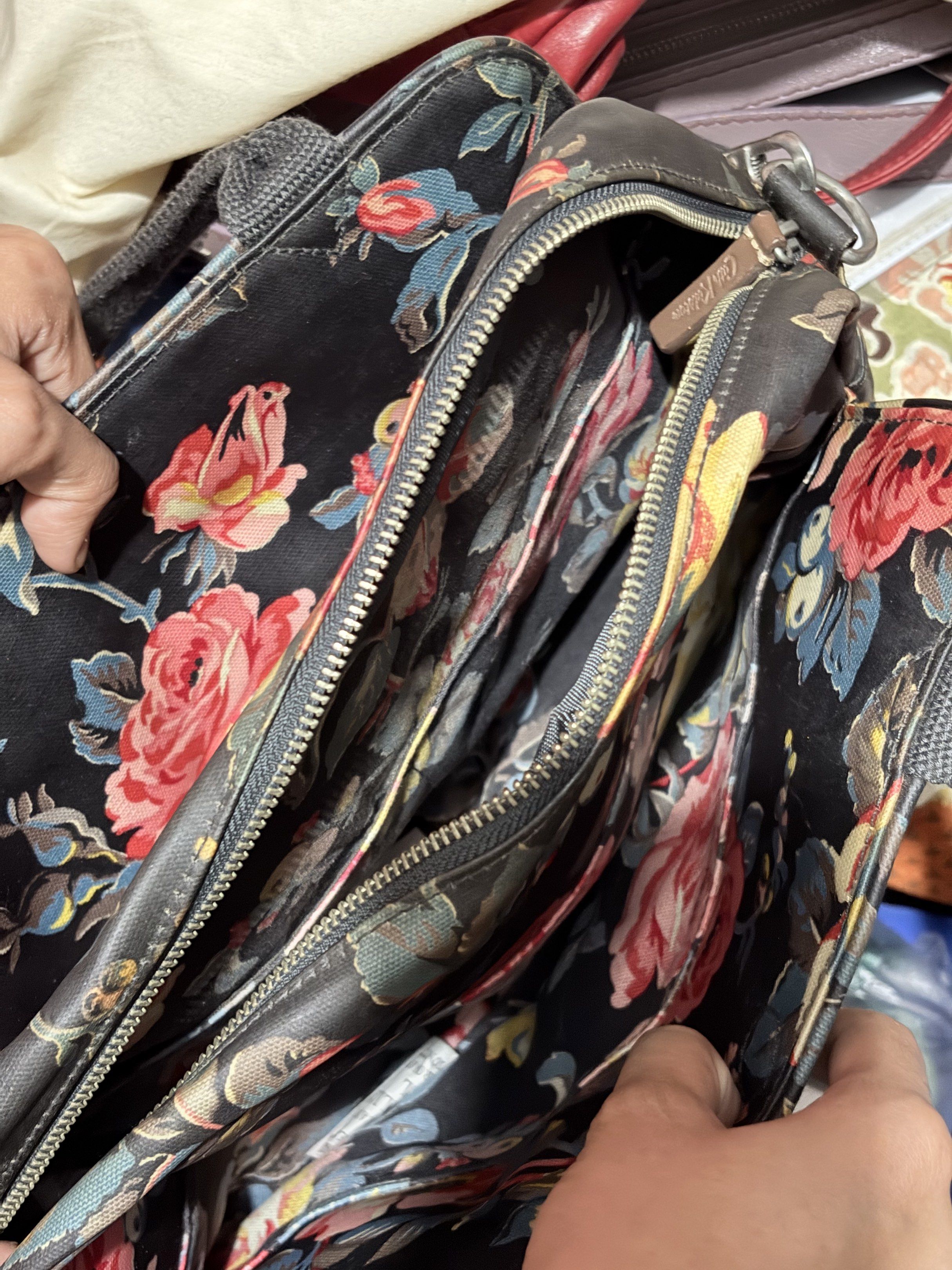 Cath Kidston Floral Handbag with Shoulder Strap (Category: Shoulder Bags) located in Manila. Submitted by cufflej (Listing ID 1418958137, Image 3). Description: - Authentic Cath Kidston handbag - Beautiful floral pattern - Top handle and detachable shoulder strap - Multiple interior compartments - Floral interior lining - Leather handle accents.