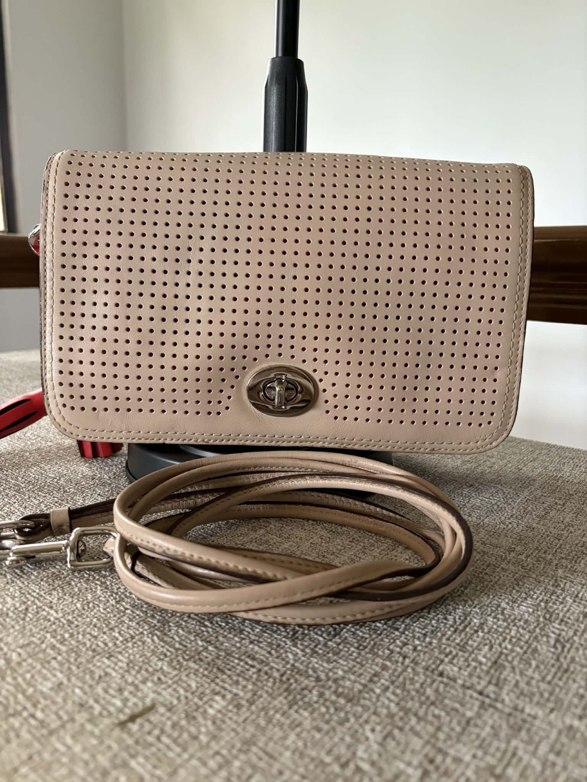 Coach Penelope Crossbody Bag (Category: Luxury Bags & Wallets) located in Dasmarinas. Submitted by melram83 (Listing ID 1418831438, Image 1). Description: 9” x 6” x 2.5” Perforated leather This is a well-used bag See photos for condition and flaws.