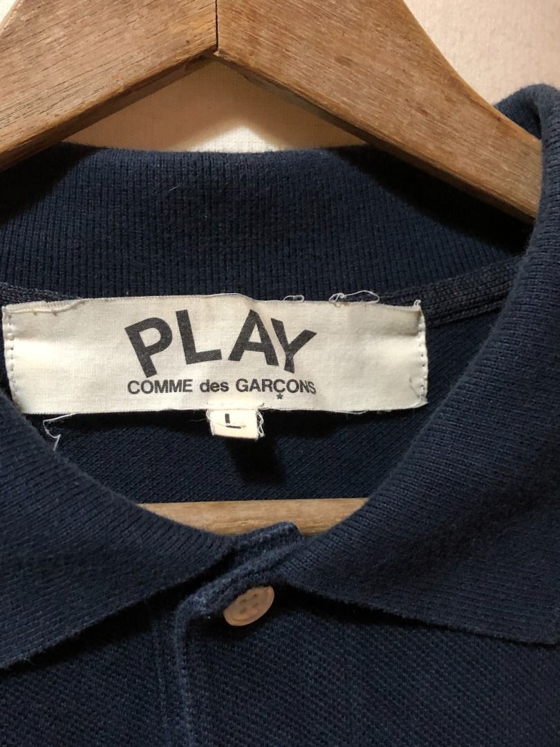 Comme des Garcons Play Polo Shirt - Navy Blue (Category: Tshirts & Polo Shirts ) located in Muntinlupa City. Submitted by cdgplaycorner (Listing ID 1418905606, Image 3). Description: CDG Navy Polo Shirt L on Tag 20 W x 27 L Color rate 9.2/10 Excellent Condition 2200 .