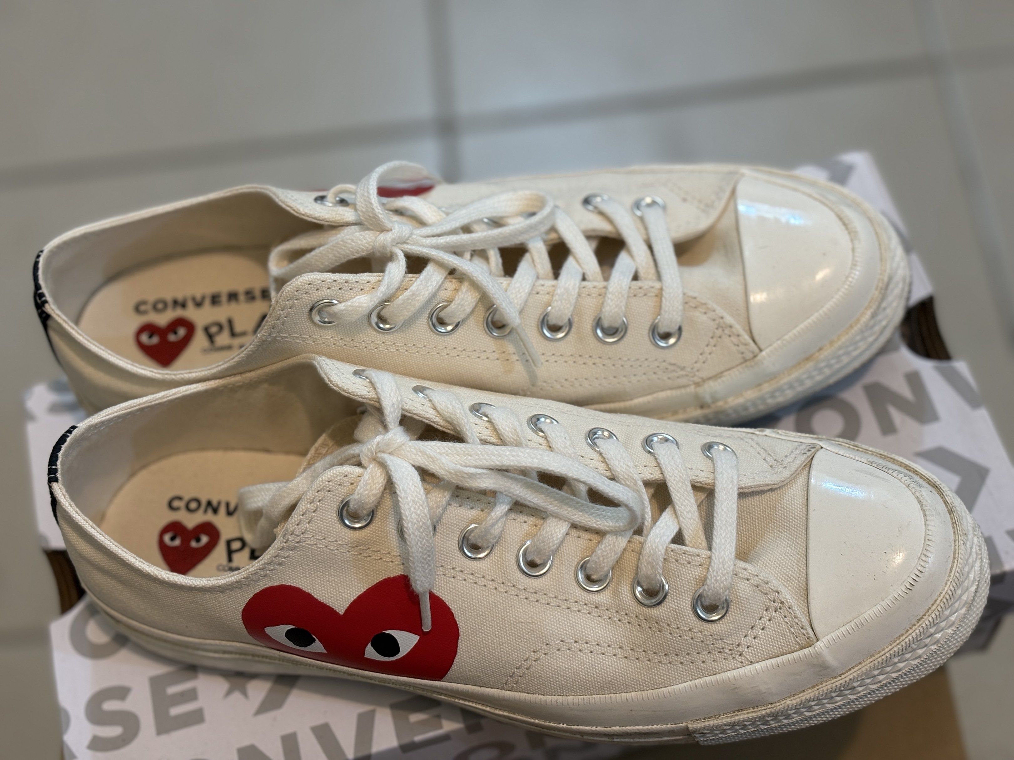 Converse x Comme des Garcons Play Chuck 70 (Size M9) (Category: Sneakers) located in Pasig City. Submitted by indigo033 (Listing ID 1418915855, Image 2). Description: ✔️ Authentic Converse x Comme des Garçons ✔️ Color: Beige ✔️ Condition: Slightly used, just needs a little bit of cleaning Details: • Size: US Men’s 9 / Women’s 11 • Includes original box 🏷️ Price is negotiable.