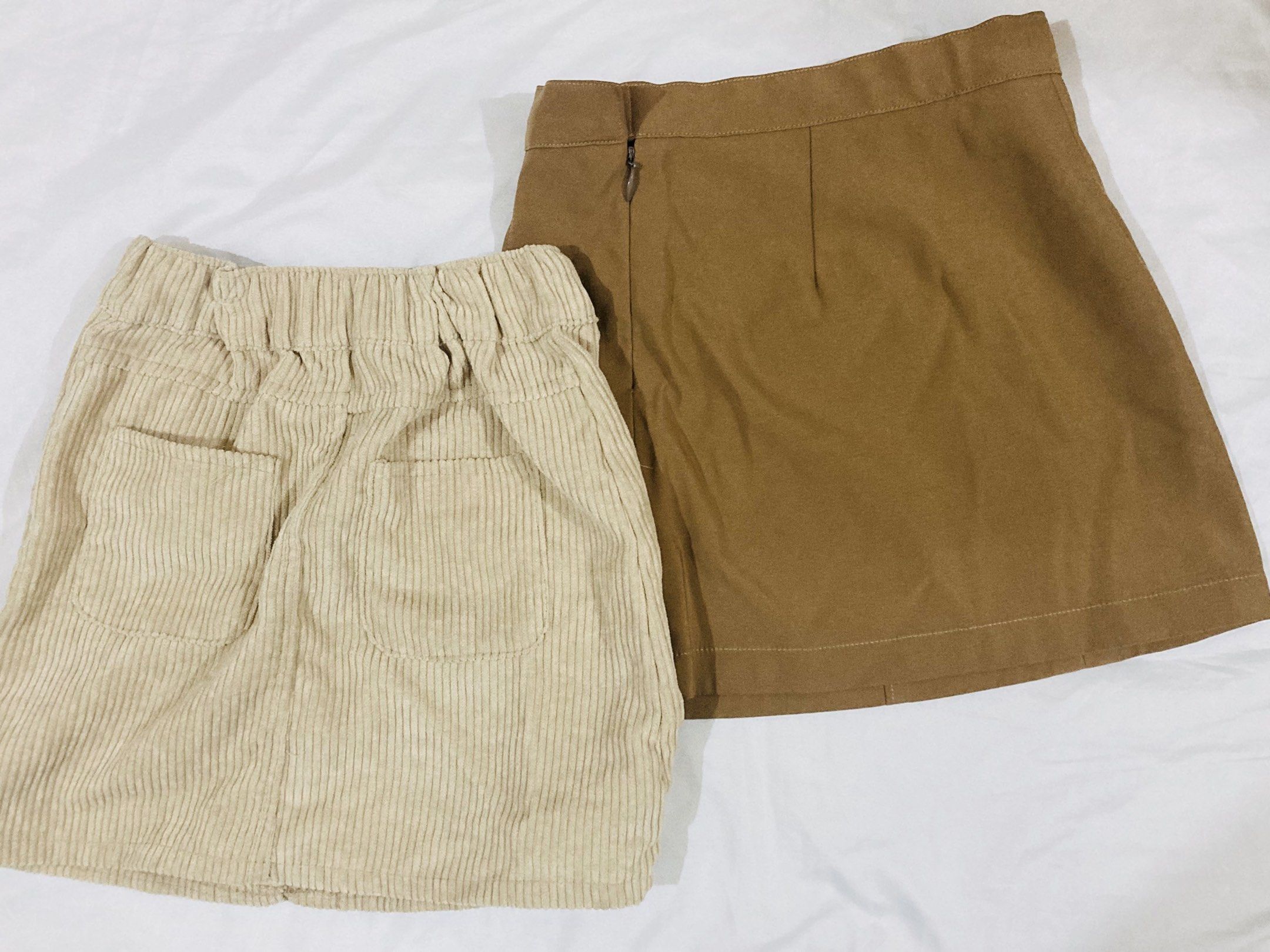 Corduroy and Brown Skirts bundle (Category: Babies & Kids Fashion) located in La Trinidad. Submitted by secondsmatter (Listing ID 1418899664, Image 2). Description: - Corduroy mini skirt: - Button closure - Pockets - Button details - Brown mini skirt: - Side zipper - Buckle detail.