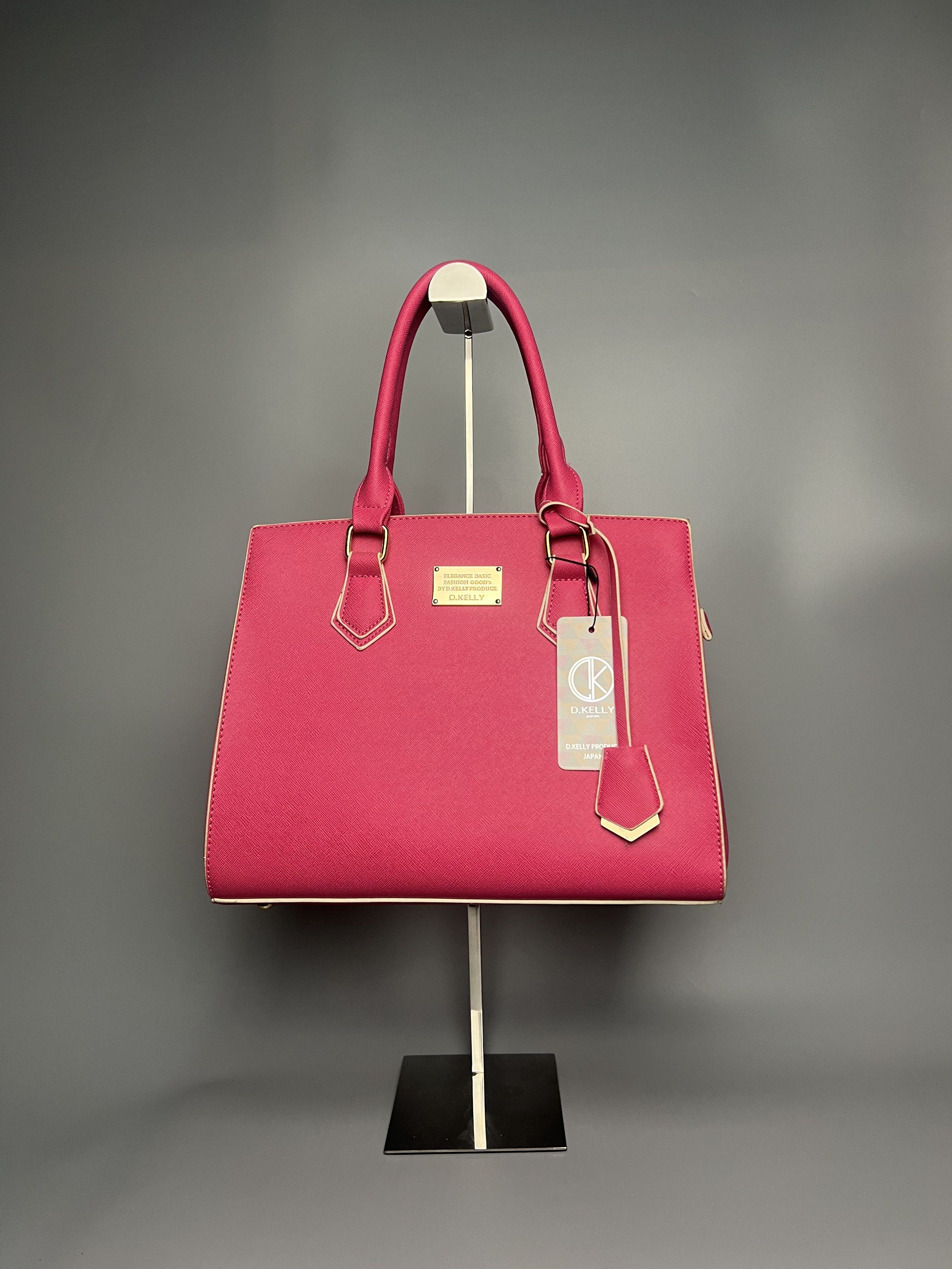 D. Kelly Handbag - Pink (Category: Luxury Bags & Wallets) located in Manila. Submitted by reclaim.13 (Listing ID 1418901972, Image 1). Description: - Brand: D. Kelly - Color: Pink - Design: Top handle bag with detachable shoulder strap - Hardware: Gold-tone accents - Interior: Black lining with zippered pocket - Origin: Made in Japan.