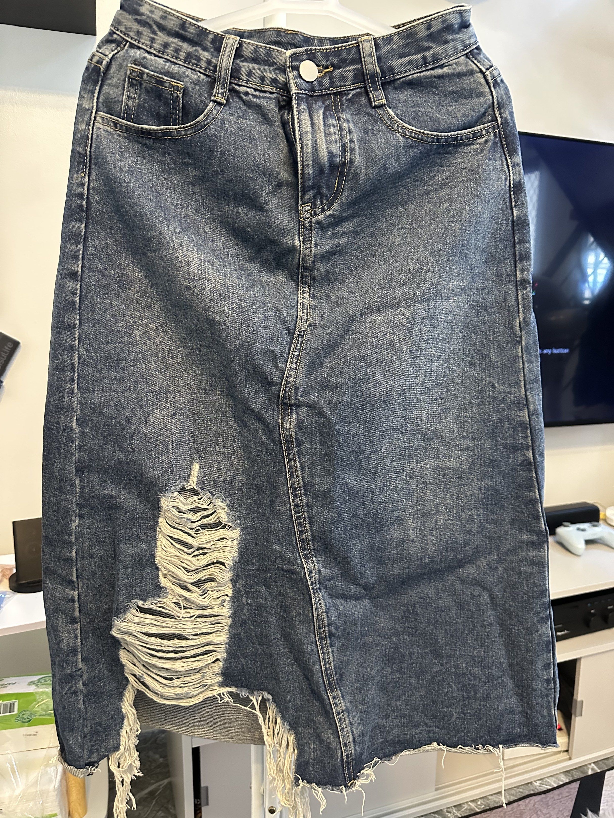 Denim Distressed Midi Skirt (Category: Skirts) located in Makati City. Submitted by ideclutteritems.ph (Listing ID 1418800058, Image 1). Description: - Distressed denim midi skirt - Medium wash color - Button and zipper closure - Two front pockets .