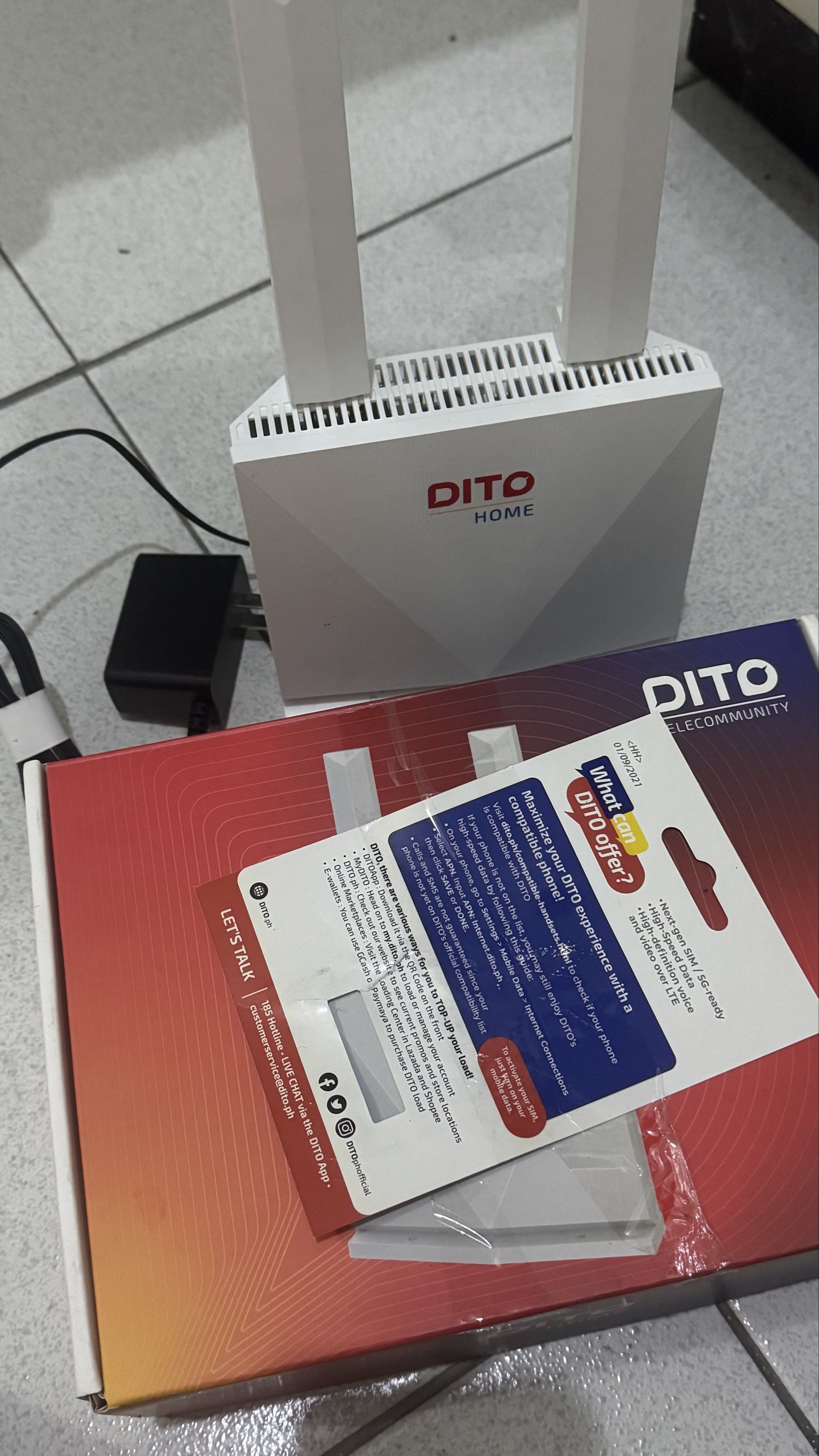 DITO Home WiFi Router Prepaid with Sim (Category: Networking) located in Manila. Submitted by bcdeef (Listing ID 1418949116, Image 2). Description: - DITO Home WiFi router with SIM card - Includes router, power adapter, SIM card, and box - Features two antennas - SIM card provides high-speed data - Optimized for video streaming over LTE.