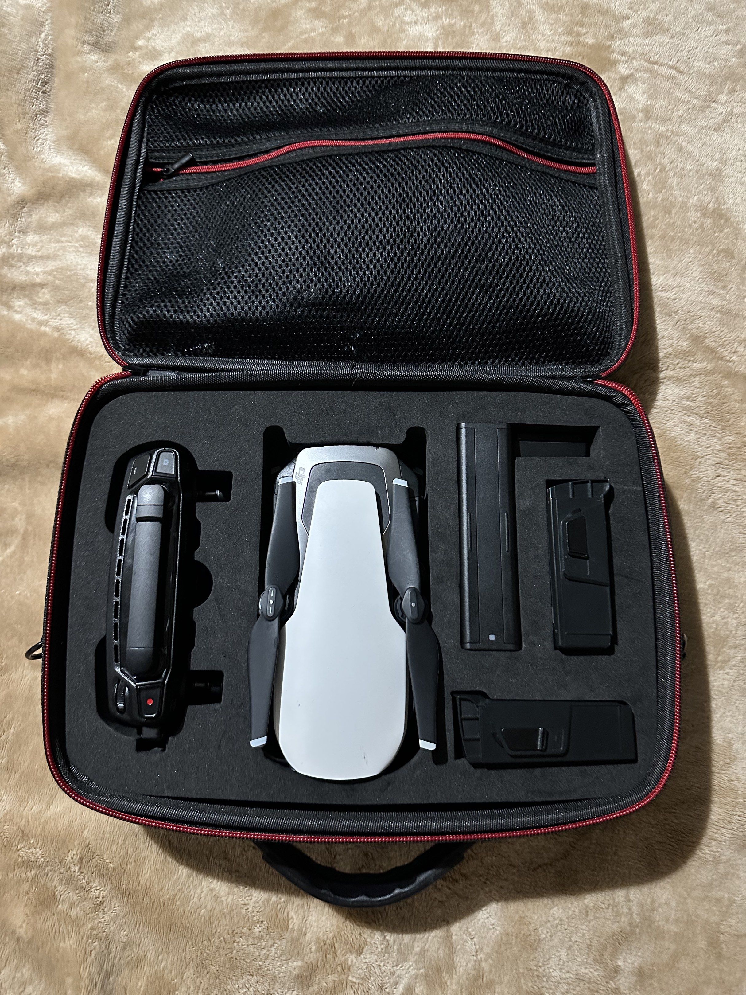 DJI Mavic Air Drone (Category: Drones) located in Makati City. Submitted by sansan.22 (Listing ID 1418832478, Image 1). Description: - DJI Mavic Air drone - Includes remote controller - Comes with charger - Features a carrying case - Includes extra propellers and charging cables - Color: White and Black No battery included.