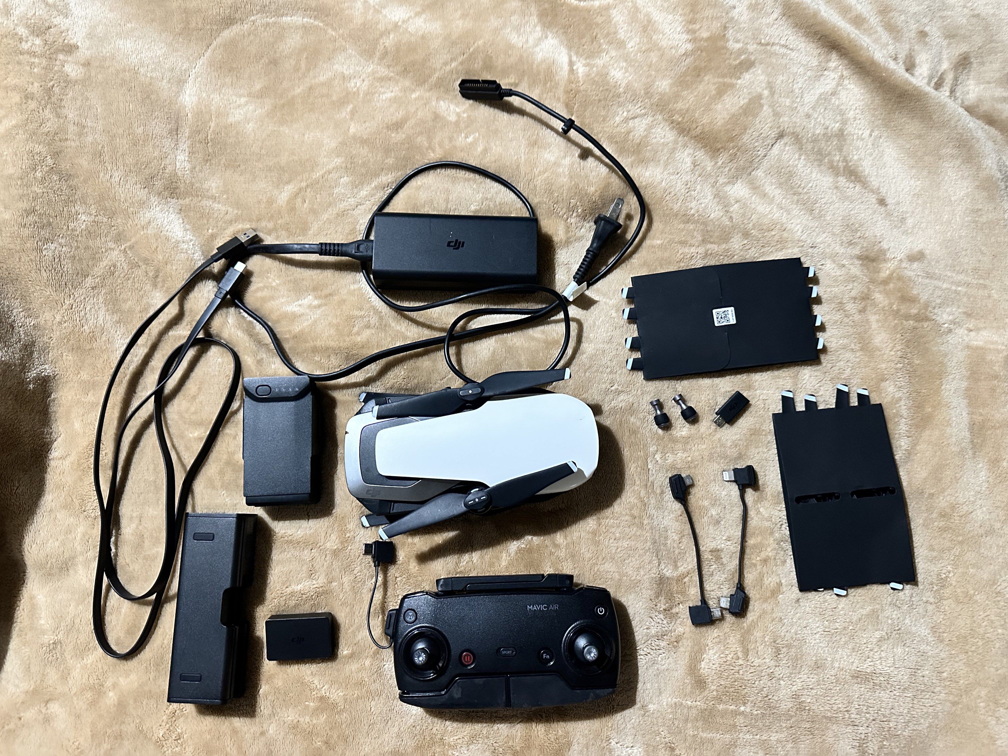 DJI Mavic Air Drone (Category: Drones) located in Makati City. Submitted by sansan.22 (Listing ID 1418832478, Image 2). Description: - DJI Mavic Air drone - Includes remote controller - Comes with charger - Features a carrying case - Includes extra propellers and charging cables - Color: White and Black No battery included.